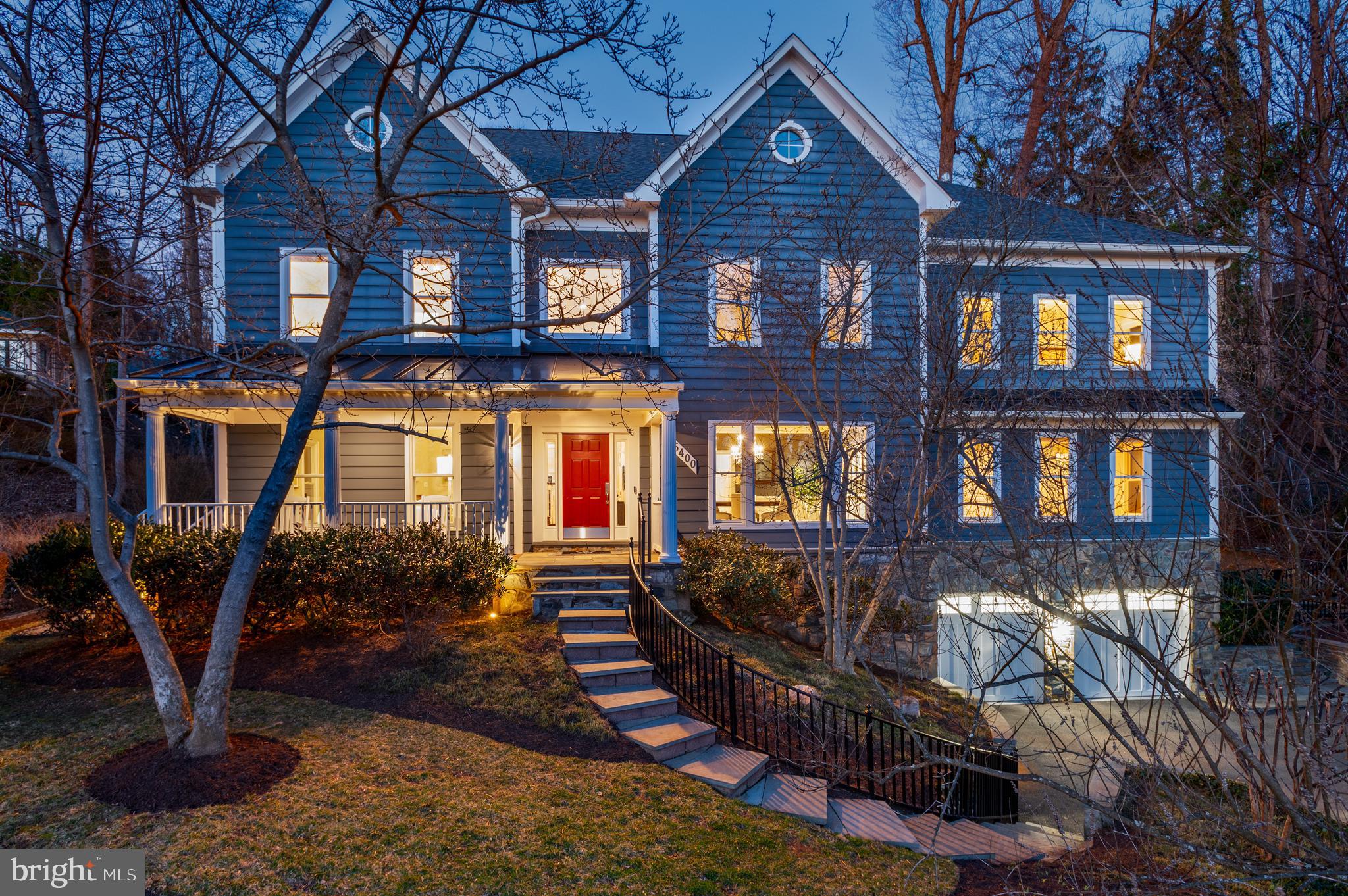 New Price Improvement! 
With breathtaking sunset views, 5400 Mohican Rd is a beautiful custom home built by Renaissance Homes that has been thoughtfully refined over the years. The interior offers soaring ceilings, beautiful hardwood floors, oversized windows, crown moldings, and exceptional craftsmanship throughout. The spacious 9,600+ square foot floor plan gives the home an incredible flow for entertaining and everyday living, while giving optionality with a first floor bedroom suite and dedicated playroom/den.  The home sits on a private half acre lot and is surrounded by gorgeous landscaping, a bespoke rear yard and sports court.  It also conveys with a coveted family membership to Mohican Pool!
The gracious foyer sets the tone of beautifully finished interiors with the formal living and dining room on either side. In the formal living room, a double-sided fireplace connects to a richly appointed library, wrapped in custom built-ins and textured grasscloth walls. Across the foyer, the sun drenched elegant dining room flows seamlessly to the kitchen through the butler’s pantry. 
At the heart of the home, the two-story great room offers soaring 19-foot ceilings and dramatic arched windows, illuminated by a pair of Restoration Hardware chandeliers. French doors open directly to the rear patio, creating an effortless indoor-outdoor connection. The renovated kitchen blends beauty and performance with crisp white and gray cabinetry, Carrara quartz and black granite countertops, and professional-grade appliances from Viking, Sub-Zero, and Bosch. Three skylights flood the informal dining area with natural light, while the convenient back staircase provides ease for everyday living.
Upstairs, the primary suite unfolds as a private retreat just beyond the upper landing. The vaulted bedroom is anchored by a large arched window and a two-sided fireplace shared with the adjoining sitting room, where an infrared sauna creates a spa-like sanctuary. The luxurious bath features dual vanities, a freestanding Sansiro soaking tub, a Carrara marble steam shower, and three walk-in closets with ample storage. Completing this level are three additional bedrooms including one with an en suite, two more that are connected by a Jack-and-Jill bath, and a convenient laundry room. 
The lower level is an entertainer's dream with a recreation room that is centered around a stylish bar with custom shelving and a library ladder that adds a touch of architectural charm. Behind double doors, a temperature-controlled wine cellar accommodates up to 3,000 bottles. A fitness studio, media room, bonus room, and half bath offer both places for the kids and adults. The additional bedroom, full bathroom, and direct access to the front, make it the perfect in-law or au-pair suite. Finishing the lower level is direct garage access, which has been upgraded with a durable epoxy floor and an EV charger for modern convenience.
Equally impressive are the home’s thoughtful systems and amenities, including ADT security, a Generac generator, and built-in speakers throughout the main level. Outside, the landscaped grounds include a flagstone patio with a Lynx grill and fire pit anchors the outdoor entertaining areas, while a sports court and turf play spaces invite recreation. Exterior speakers, lighting, irrigation, and drainage systems ensure comfort and ease.