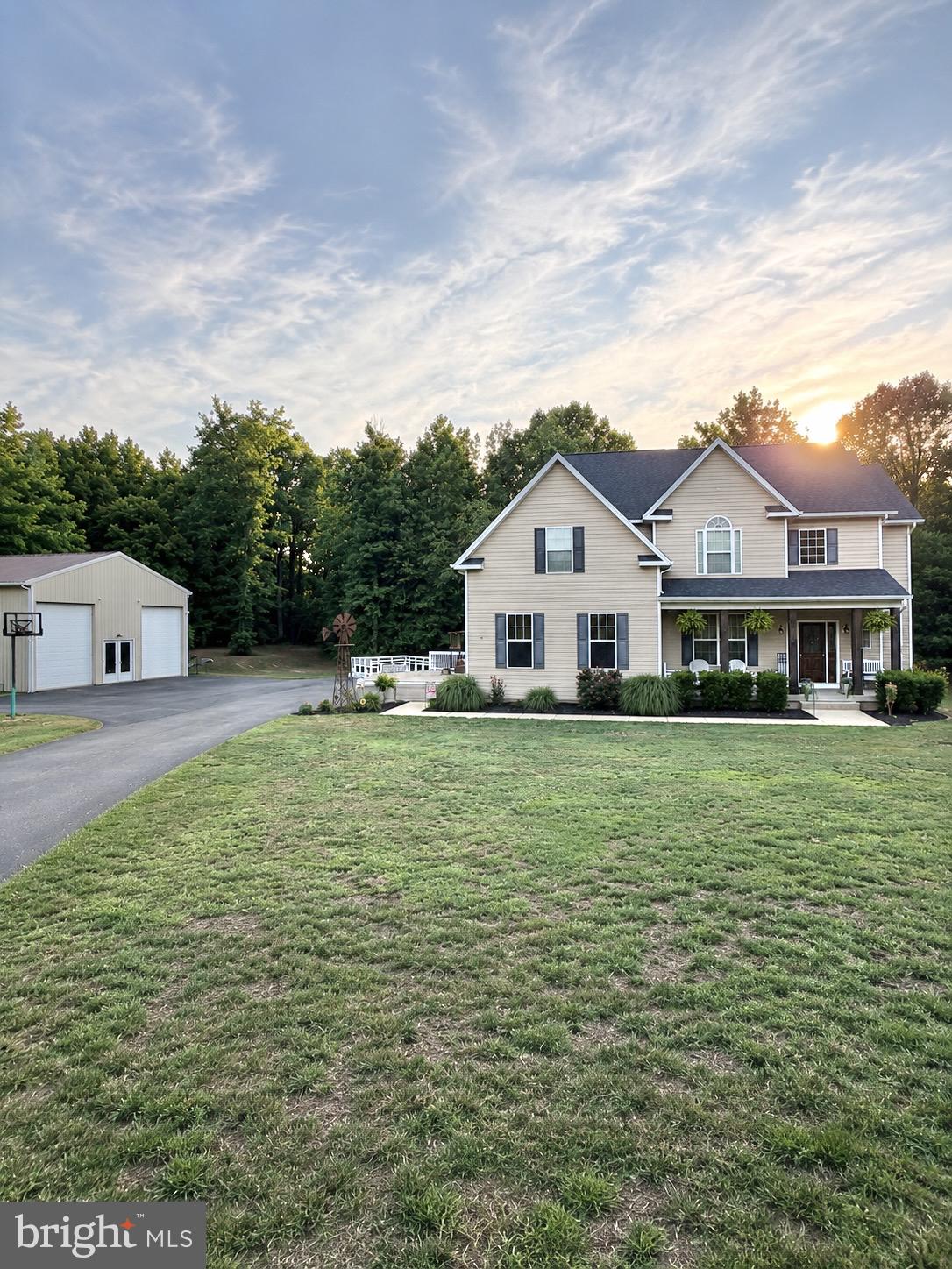 Welcome to this beautifully updated 4-bedroom, 2.5-bath home situated on a private 3-acre lot in Hughesville! Offering proximately 3,400 square feet of living space, this property perfectly combines comfort, functionality, and outdoor entertainment.

Inside, you’ll find an open-concept floor plan featuring a spacious kitchen with an oversized island, fresh paint and updates throughout, crown molding, custom wood window trim and design details, a beautifully designed built-in living room bookcase, and a stunning 20x20 addition providing even more living space.

Step outside and enjoy the expansive wrap-around deck, attached fire pit area, and extended paved parking area designed for entertaining family and friends.

Car enthusiasts, hobbyists, or business owners will love the impressive 40x30 pole barn with extended ceiling height, offering endless possibilities for a workshop, office, gym, or additional storage. The pole barn also features a BendPak 10,000-pound vehicle lift, making it the perfect setup for automotive enthusiasts or those needing a dedicated workspace.

Additional features include:

• New roof (July 2023)

• Upgraded attached garage with TV area, electric fireplace/heating, and built-in closet

• Plenty of storage space, including a covered rear storage area leading to the walk-out basement

• Private 3-acre setting with plenty of room to enjoy the outdoors

• Open and inviting layout ideal for everyday living and entertaining

This one-of-a-kind property offers the privacy of country living while remaining conveniently located near shopping, schools, and commuter routes. Don’t miss your opportunity to own this exceptional Southern Maryland property!