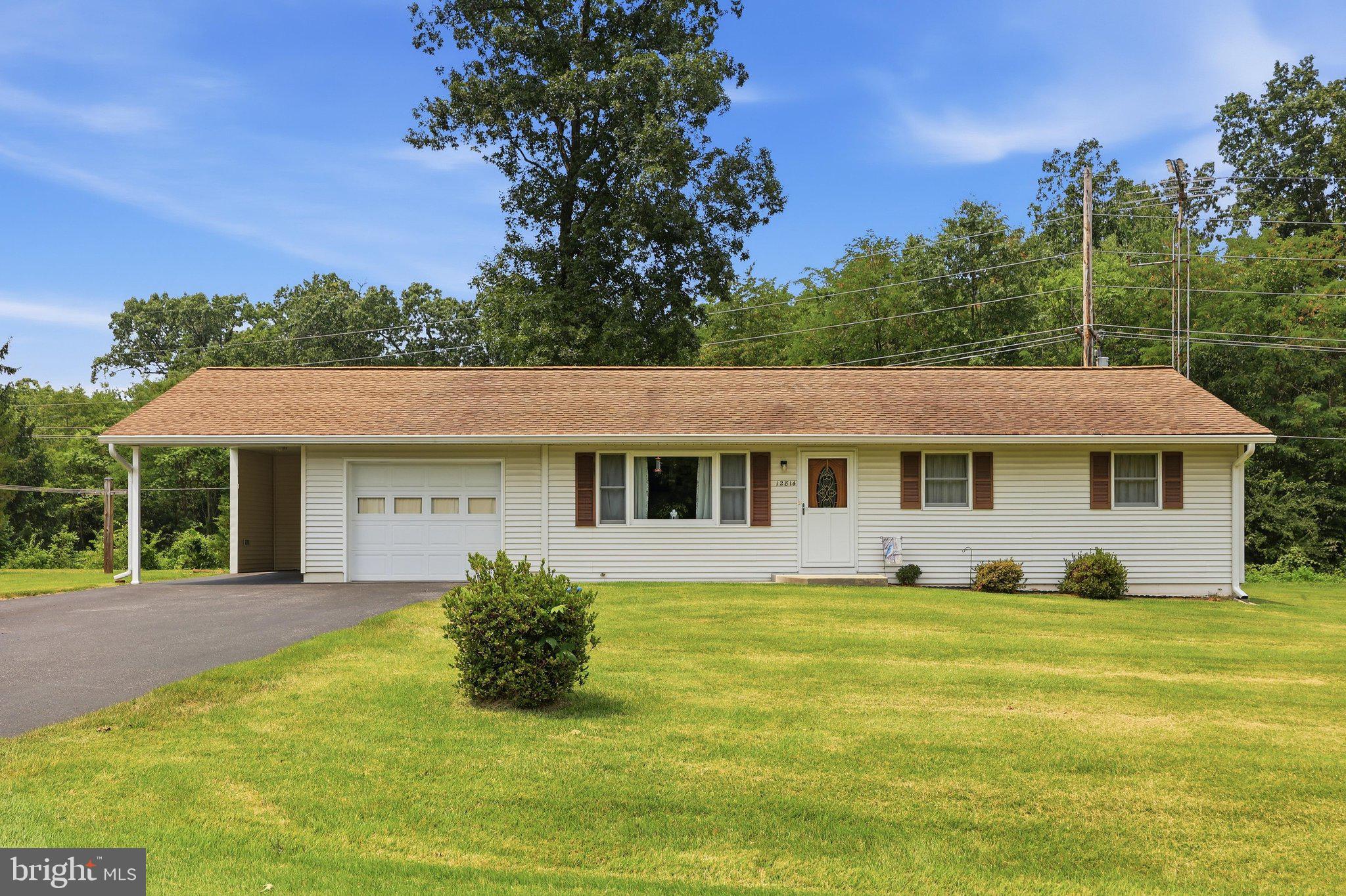 Welcome home to this well-maintained rancher situated on a spacious 1.16-acre lot, offering the perfect blend of country living and convenience. This inviting home features 3 bedrooms, 1 full bath, and beautiful hardwood floors throughout most of the main level, with durable flooring in the kitchen and bath. The bright living room is filled with natural light from a large picture window, while the eat-in kitchen provides plenty of space for casual dining. A convenient main-level laundry area is located in the attached one-car garage, with an additional laundry hookup available in the full unfinished basement, offering endless possibilities for future expansion, a workshop, recreation space, or additional storage. Outside, you'll find a one-car carport, storage shed, and plenty of room to enjoy the open 1.16-acre property. Recent updates provide peace of mind, including a new HVAC system (2024), gutters and downspouts (2020), and water heater (2019). Whether you're looking for your first home, downsizing, or searching for a property with room to grow this well-cared-for home is ready for its next owner!