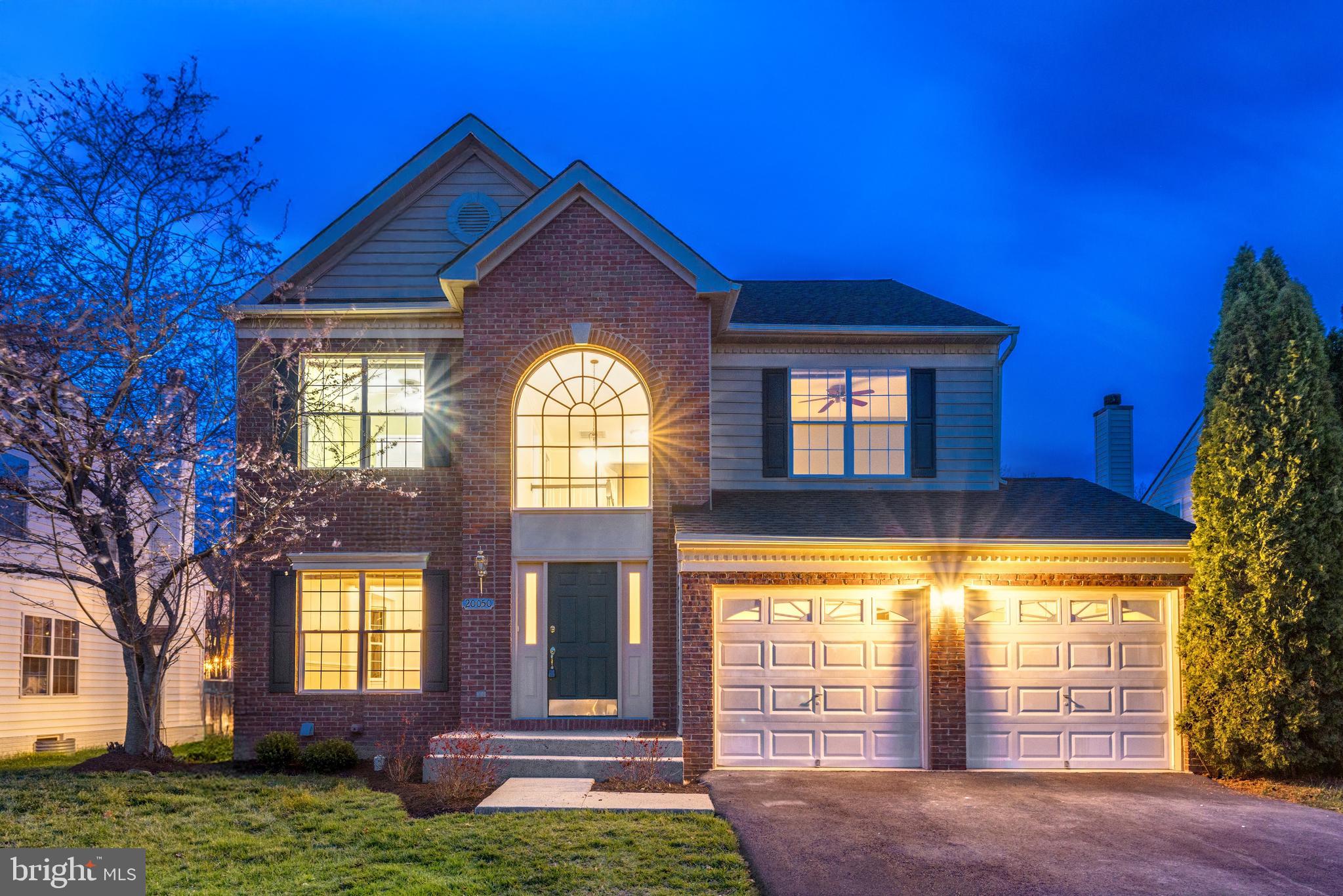 This Belmont Country Club home has been thoughtfully updated to combine a generous floor plan with every modern comfort. Refreshed, refined, and ready for you to make it your own! Arrive to a stately brick facade with plantation shutters and a double-stall, 2-car garage. Inside, a soaring double-height foyer invites natural light and flows into the home’s formal entertaining spaces. In the newly reimagined kitchen, 2025 renovations showcase designer finishes alongside a charming eat-in dining area, perfect for casual meals and conversation. The home’s versatile living spaces include a family room with a box bay window and fireplace, formal living room, and formal dining room with bay window. Upgrades in 2025 continue underfoot with brand new main-level flooring and new carpeting throughout, complemented by updated light fixtures. The primary suite is a sanctuary with an elegant tray ceiling, two walk-in closets, and a luxurious bathroom also renovated in 2025. Three additional bedrooms share two updated full baths, one upstairs refreshed in 2025, the other on the lower level updated in 2022. Downstairs, a huge recreation room with wet bar and walk-up access to the backyard provides additional space for relaxation and entertainment. The laundry room features a brand new tub. Outside, you’ll love peaceful outdoor living on your custom deck overlooking the beautiful, landscaped yard backing to trees. Enjoy peace of mind with recent improvements including: roof replaced with 50-year shingles (2019), bottom level HVAC (2020), top level HVAC (2024), brand new water heater and fresh paint throughout most of the home (2025). The coveted community of Belmont Country Club surrounds you with amenities, from community pools, tennis, basketball, volleyball, playgrounds and trails, to an Arnold Palmer 18-hole golf course with a 35,000 sq ft clubhouse inspired by historical Virginia designs. All within close proximity to highly rated schools, nearby shopping, diverse dining options, and easy access to all the best of northern Virginia. Offering space, location, and luxurious updates, this move-in ready home is just waiting for you.
