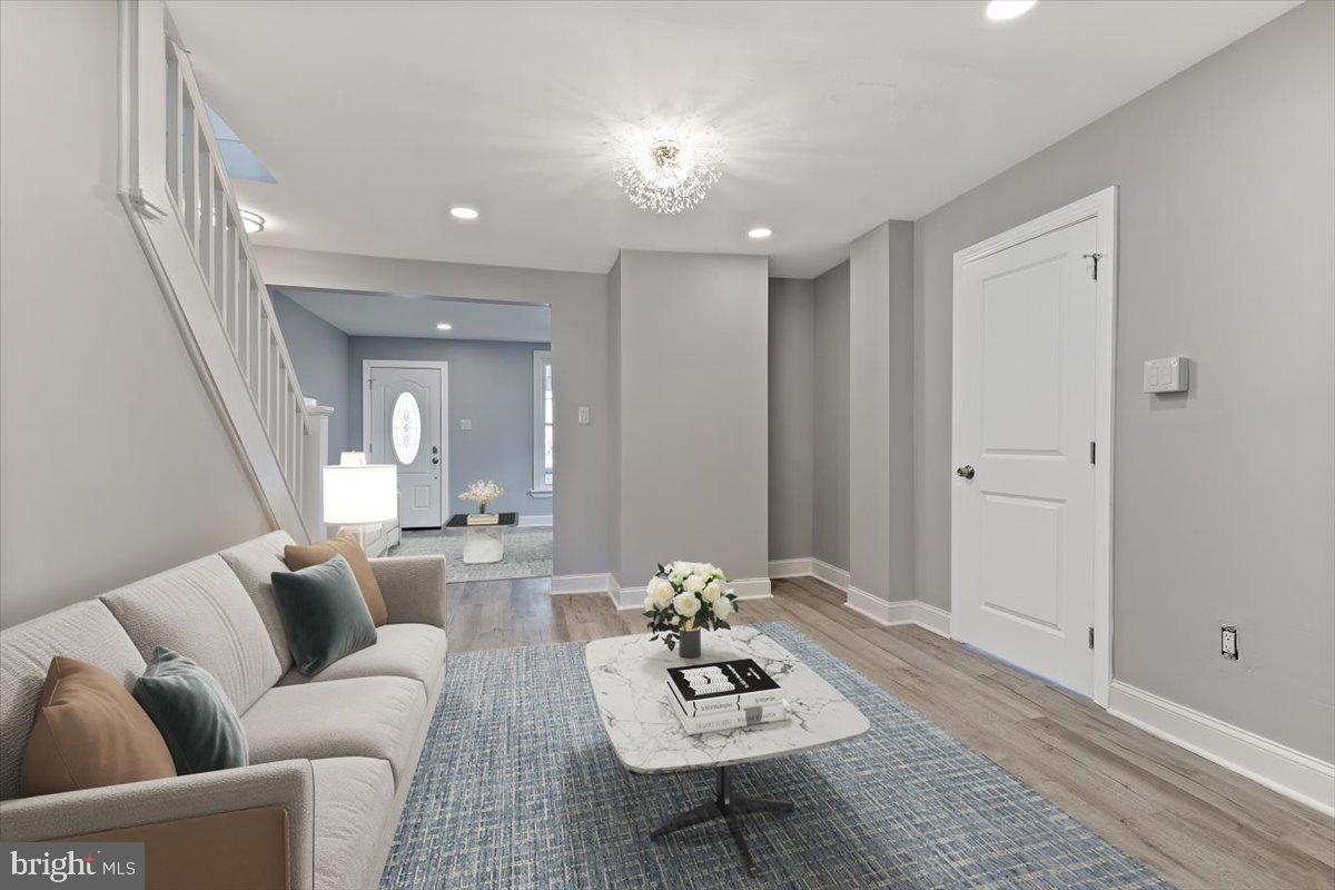 NEWLY RENOVATED Main Line home, complete with all the latest amenities, and just a short 8-minute walk to the R5 SEPTA station (Paoli/Thorndale).  Set in a quiet, walkable neighborhood, this 5 bedroom, 3 full bath home in the award-winning Tredyffrin-Easttown School District has just undergone a complete renovation from top to bottom.  Finished in contemporary colors with trendy light fixtures, recessed lighting, and luxury vinyl plank flooring in every room, it is timeless with a trendy aesthetic.  It features a main level bedroom with adjacent bath, making it the ideal setting for a multi-generational family. Upon entering the home, you will immediately notice the bright, open, and modern feel, with clear sight lines all the way to the back of the home. The formal living room flows into a spacious and comfortable family room, which in turn leads to the formal dining room and huge eat-in-kitchen beyond.  The kitchen features all-new stainless steel appliances, granite countertops, a pantry and loads of space to accommodate a table for breakfast or a casual dinner.  Importantly, there is direct access to the 2-car private drive and brand new patio!  Additional parking is available in the parking lot behind the home as well as along Railroad Avenue.  Whether unloading a big haul from Costco or entertaining out back on a weekend afternoon, you will find the flow of this home to be exceptional.  The bedroom on the first level is ideal for anyone who may find stairs a challenge, and there are none when coming in the back door.  This bedroom has it’s own massive, spa-like bath with a soaking tub accented by it’s own whimsical chandelier!  What a wonderful place to relax at the end of a long day.  Heading up to the second level, discover the bright and spacious primary suite with loads of space, and it’s own private bath with high end finishes.  Down the hall there is another new full bath  and a bright and spacious bedroom.  Up to the third level, you’ll find two more bedrooms, one of which is absolutely massive and could easily function as both bedroom and office space, or perhaps a workout room.  In addition to the amazing interior, there are multiple outdoor spaces for unwinding or entertaining.   The spacious & private front porch is the perfect space for morning coffee,  a glass of wine at the end of a long day, or say hello to your neighbors out for an evening walk.  A walk leads around to the back of the home which is highlighted by a brand new oversized patio, stretching across the full width of the home.  What a wonderful spot for grilling during the Eagles game, relaxing on a summer afternoon, or taking in some fresh air in the evening.  Updates to this home are too many to list but include 3 new bathrooms, all new energy efficient windows, brand new heating & air conditioning on all 3 levels with 2 zone control, wiring, recessed lighting in all rooms in addition to the trendy fixtures, luxury vinyl plank flooring throughout the home, paint, and appliances to name just a few.  This home is in the award winning Tredyffrin-Easttown School District and commuting into the city or anywhere along the main line is a breeze since you can walk to the Paoli SEPTA station.  You can also walk to a variety of places in your neighborhood, including Sushi Nami, Nudy’s Café, Cup of Dreams Coffee & Tea, Home Cooked, or grab a beer and dinner at TJ’s Restaurant & Drinkery.  A wonderfully renovated home, perfect for families of all sizes, in a quiet neighborhood, that is walkable to so many places with easy access to the Main Line and Philadelphia.  Check this one out before it’s gone; Welcome Home!