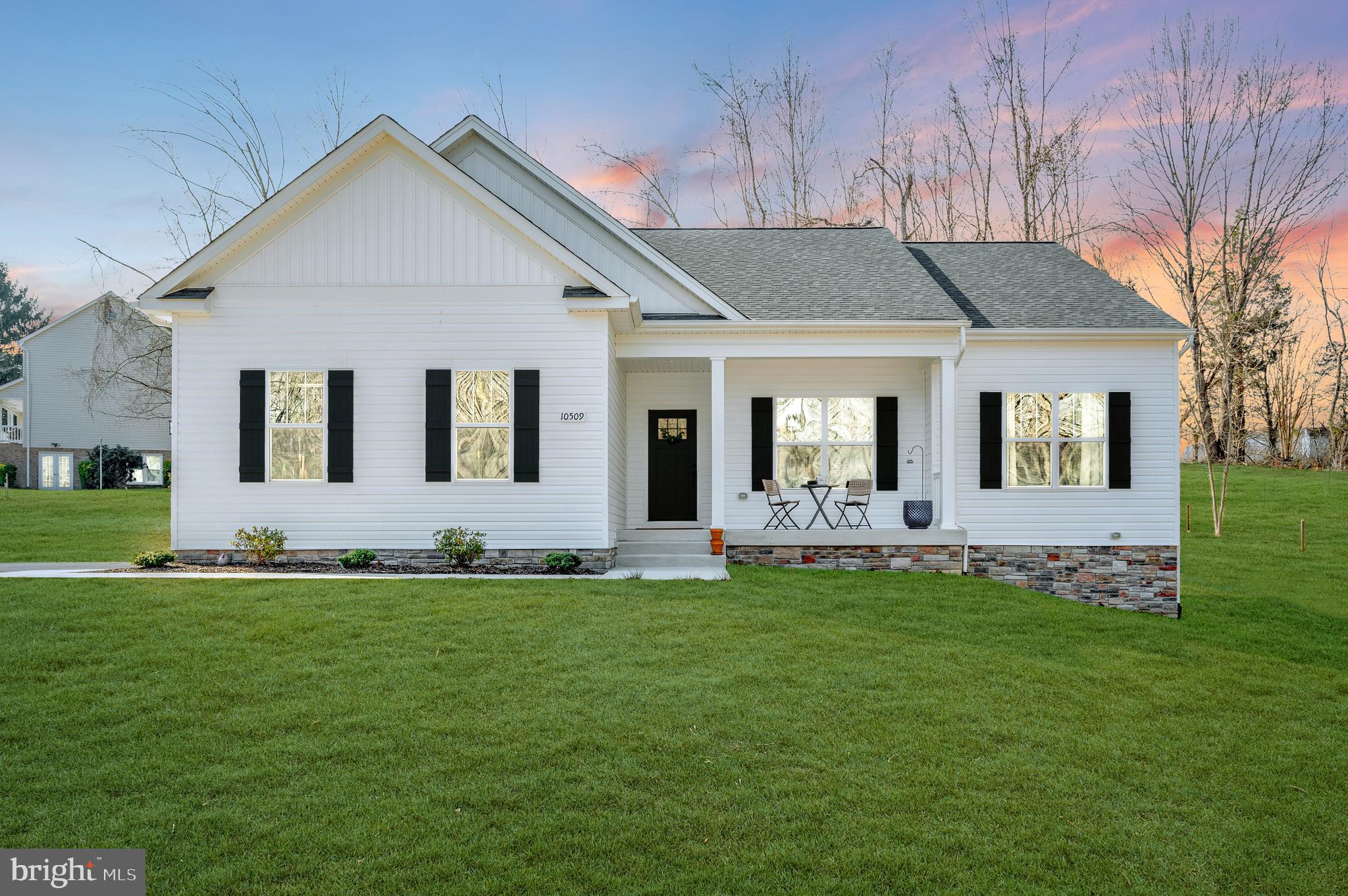 Just completed in 2024! Why wait to build when this stunning Clayton model by Foundation Homes is MOVE-IN READY? This craftsman-style rambler offers an open floor plan with views of the picturesque Ni River Reservoir and a fully finished lower level packed with high-end upgrades. The main level features a spacious family room with cathedral ceilings, flowing seamlessly into the gourmet kitchen, complete with shaker-style cabinets, quartz countertops, stainless steel appliances, a wall oven, cooktop, built-in microwave, and a stainless undermount sink. Luxury vinyl plank flooring throughout adds a sleek, modern touch. The primary suite is a true retreat, featuring a spa-like master bath that includes a spacious walk-in shower, his & her sinks, and a large walk-in closet. A mudroom and laundry room with a built-in bench provide practical storage space for everyday living. Main level also includes two additional spacious bedrooms. The finished walk-up basement is perfect for entertaining, boasting a huge recreation room, an additional bedroom, a full bath, and a media room—plus plenty of storage for all your extras! Step outside onto the expansive composite deck with views of the large flat yard and wooded scenery. Located in the sought-after Lake Acres community nestled along the Ni River Reservoir, don't forget to enjoy the community lot that includes walking trails, a picnic pavilion, and access to the reservoir! The seasonal Ni River Recreation Area is a two minute drive and offers a boat launch, rental boats, and fishing for bass, catfish, crappie, and sunfish! This home offers scenic beauty and unbeatable convenience, just minutes from I-95, downtown Fredericksburg, and major shopping. . In addition, the Gordon Road commuter lot is a short 10 minute drive, and easy access to the Spotsylvania and Fredericksburg VRE stations offer plenty of options for commuters.  Don’t wait—move in today!