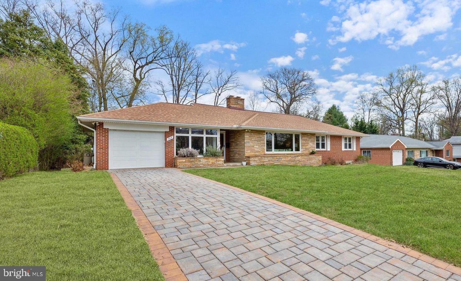 Welcome to this mid century oasis, a charming 4-bedroom, 3-bathroom home offering the convenience of one-level living on a spacious lot. Thoughtfully updated and move-in ready, this residence features a renovated kitchen with fresh paint, refinished floors, a breakfast bar, gas cooking, and stylish pendant lighting. The main level boasts a separate dining room and a light-filled living room anchored by a cozy fireplace. There are three bedrooms and two full baths on this level including the primary suite. A sunroom with brick detailing extends the living space, providing a perfect retreat for relaxation or an ideal work from home space.  Incredible windows drench the interior with natural light.

The fully finished lower level adds versatility with LVP floors, a fourth bedroom, a full bath, and tons of storage—ideal for guests, a home office, or additional living space. The home also features a full length storage attic that could be the basis for expansion to a second level.

The rear exterior is perfect for outdoor activities with a large flat fenced in yard, patio, and a shed for additional storage. 

Upgrades abound in this home with a recent roof replacement, window replacements, custom wood trimmings and mantle, recent furnace, and a recent permeable paver driveway. The deep one car garage is also wired for 2 20 AMP Level 2 chargers. 

Nestled in the desirable Burnt Mill neighborhood, this home offers easy access to major commuter routes, including New Hampshire Avenue, Columbia Pike, and I-495. Don't miss this fantastic opportunity to own a beautifully updated home in a prime location!