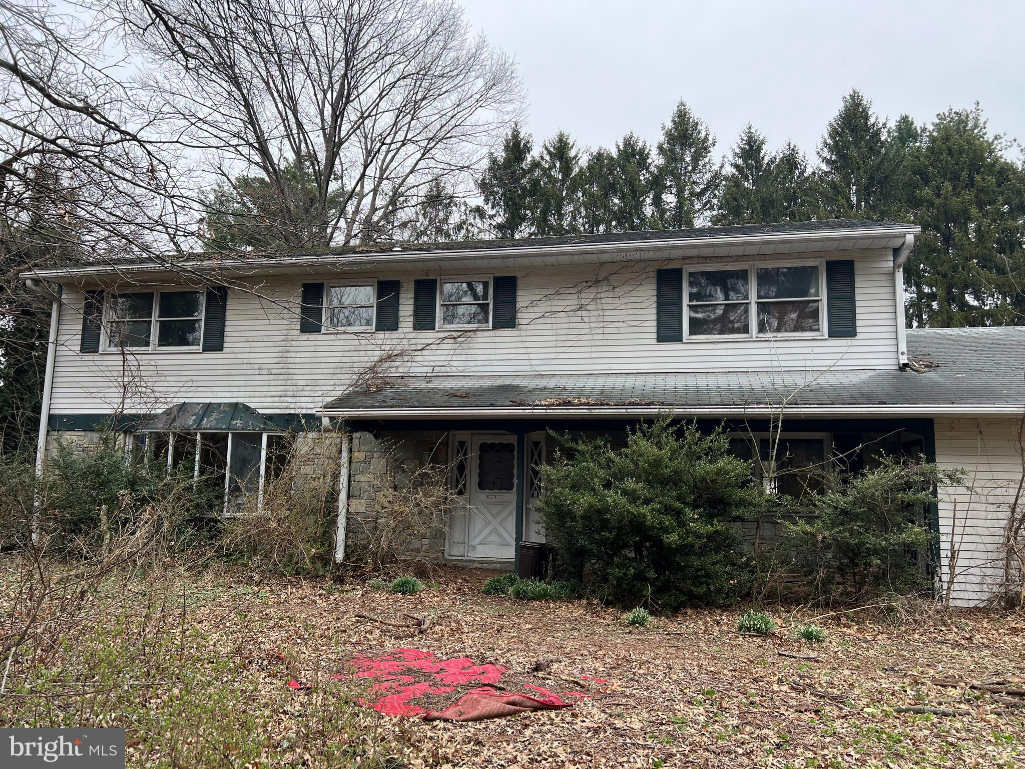 OFFER SUBMISSION DEADLINE OF WEDNESDAY, MAY 14TH 9 AM.  
Bank-Owned Property with Tremendous Potential!
This spacious 5-bedroom, 3 full bath home is ready for a COMPLETE renovation — perfect for an investor or buyer with a team of skilled workers.  The main level features a large family room open to the kitchen, a formal dining room, formal living room, and a sunroom that fills the space with natural light. The foyer welcomes you with a stunning curved staircase. Upstairs, the primary suite boasts a fireplace, walk-in closet, and a private balcony overlooking  the backyard.  Generously sized bedrooms, most with walk-in closets, provide plenty of space for family or guests. Additional highlights include a main-level laundry room with backyard access, a bedroom and full bath on the main level, a full basement and a 2-car garage.  A new fence has been installed around the pool.  Located off of 11-15 the nearly 1 acre lot is completely private.  With its prime layout and private setting, this home offers a rare opportunity to transform it into something truly special!