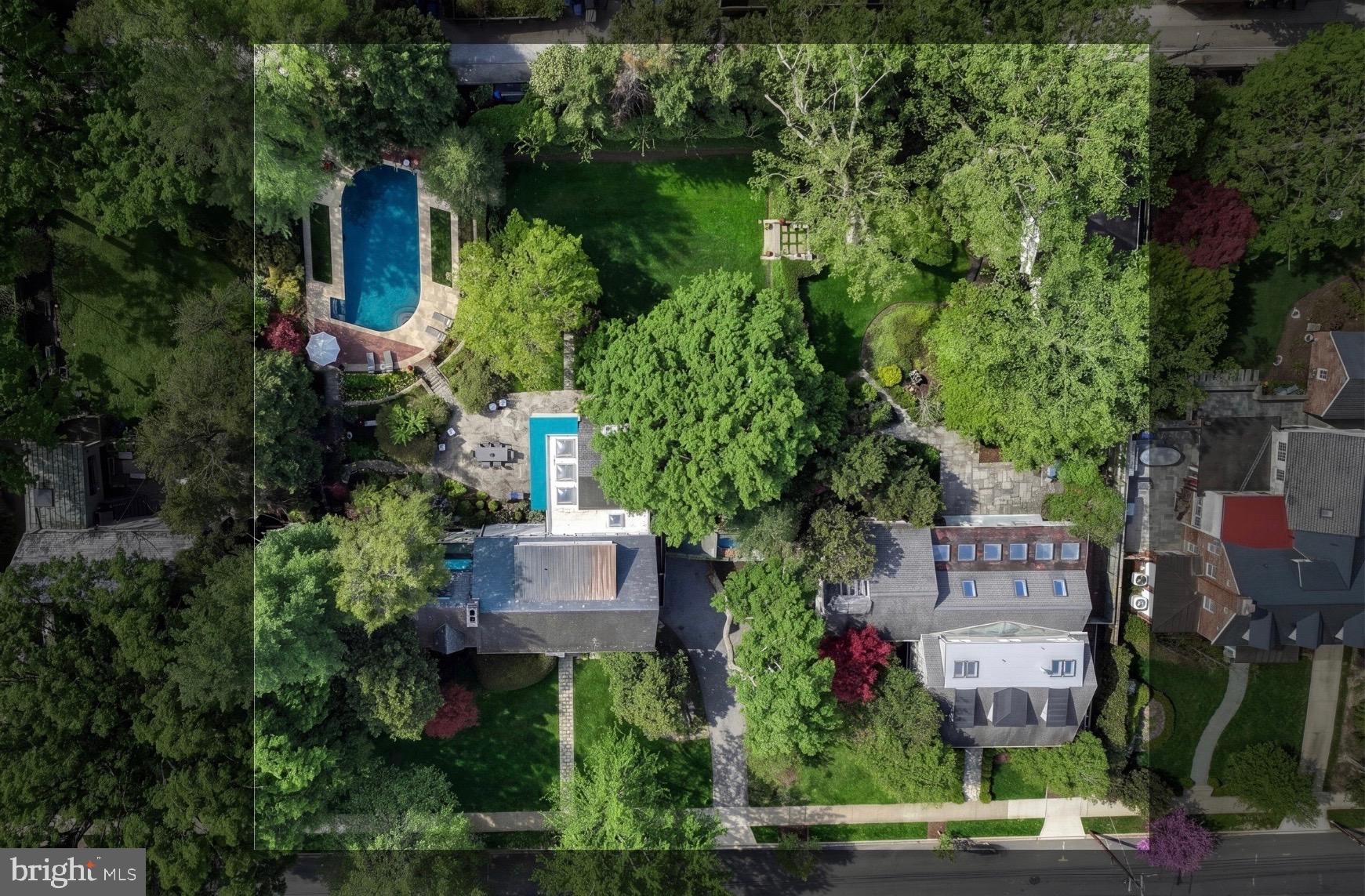 A rare offering in Washington’s Chevy Chase neighborhood, 3306 and 3308 Rittenhouse Street NW present a singular estate of remarkable scale and presence. Comprising two contiguous properties that live as one cohesive compound, the offering spans approximately 8,200 square feet with 6 bedrooms, 5 full baths, and 3 half baths, set across an extraordinary 0.91-acre parcel, a rarity within one of the city’s most established residential enclaves. 

The approach reveals a setting defined by land and landscape. Mature trees and layered plantings frame a sweeping expanse that unfolds with a sense of quiet seclusion, where the grounds read less as a traditional yard and more as a private park. What distinguishes the offering is not only its scale, but the way the two homes exist in quiet alignment. A shared backyard connects both residences in a tranquil, park-like setting that feels intentional and complete. Meandering walking paths, a pool, Koi pond, and multiple destinations for gathering and retreat are thoughtfully integrated throughout, creating an environment equally suited for intimate daily living and large-scale entertaining. A detached garage further enhances the estate’s flexibility, offering space for parking, storage, or future adaptation. 

Designed to accommodate both present living and long-term vision, the dual-residence configuration introduces a rare level of versatility. The estate lends itself naturally to a true family compound, where multiple households can exist in parallel while maintaining a balance of connection and independence. Whether for multigenerational living, extended family use, or legacy ownership, the scale and separation of the homes create a lifestyle defined by privacy and permanence. 

Beyond its immediate livability, the offering presents compelling potential for future reimagination. The combined parcels provide a substantial canvas for expansion, new construction, or comprehensive redevelopment. Opportunities of this nature are seldom seen within the city. The ability to control nearly an acre of land in one of Washington’s most established residential enclaves, while maintaining a cohesive and highly usable setting, places this offering in a category of its own. It is not simply the size, but the way the land lives and functions, creating a sense of space, privacy, and permanence rarely achieved in an urban environment. 

With its commanding land presence, cohesive design, and enduring potential, 3306 and 3308 Rittenhouse Street NW stand among the Capital Region’s most distinctive residential offerings, defined not only by what exists today, but by what it makes possible.