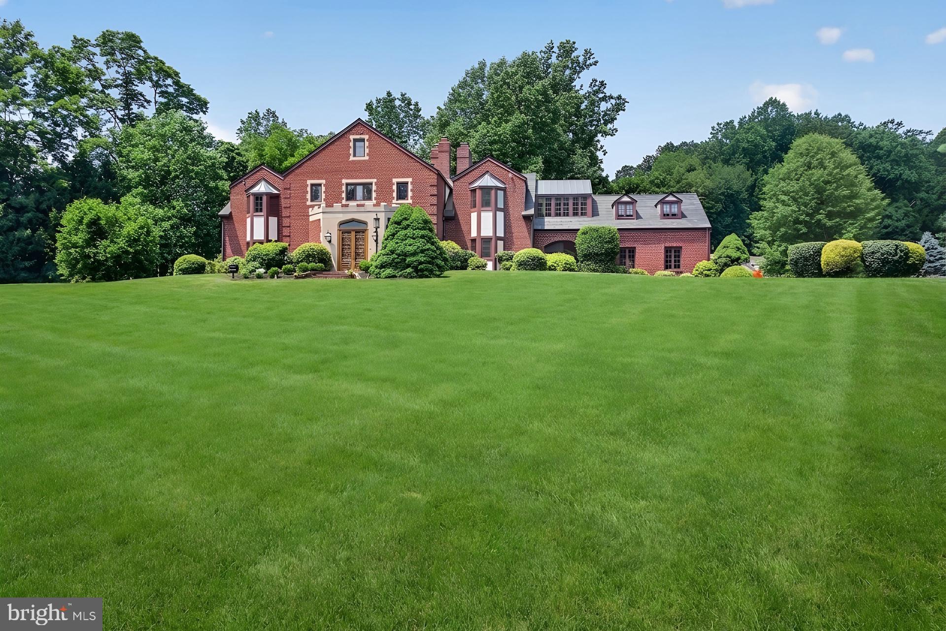 Proudly introducing Shireford, a truly extraordinary estate nestled in a coveted Chester Springs setting, where privacy, scenic beauty, and timeless Chester County character converge. Encompassing over 21 breathtaking acres across four separately deeded parcels, this remarkable property offers a rare opportunity to own a legacy estate of exceptional scale, quality, and versatility.

Arrival at formal gated entry framed by magnificent shrub beds and seasonal flowers and with first sighting of main house at a prominent elevation constructed of enduring solid brick masonry, the nearly 6,000-square-foot residence showcases enduring craftsmanship, architectural distinction, and a level of quality seldom found in today’s newer homes. A grand two-story foyer adorned with lustrous marble flooring and a spectacular Schonbek crystal chandelier sets the tone for the elegance that unfolds throughout.

Designed for both grand-scale entertaining and comfortable everyday living, the home features a dramatic sunlit two-story great room highlighted by custom oak millwork and a large wood-burning fireplace. The impressive two-story dining room, illuminated by a stunning Fine Art chandelier and opening to a private patio, creates an unforgettable setting for hosting family and friends. 

At the heart of the home, the inviting island kitchen is appointed with custom wood cabinetry and a charming wood burning fireside gathering area, seamlessly flowing into the cozy family room anchored by a handsome stone fireplace. A private first-floor ensuite provides flexible accommodations for guests or multigenerational living, while the oversized executive office/library with custom oak built-ins offers an inspiring work-from-home environment.

The luxurious primary suite serves as a private retreat, featuring a beautifully appointed bath and expansive dressing area. Three additional generously sized bedrooms and a bright natural lighted office complete the upper level, including an oversized guest suite with a private bath. A convenient second-floor laundry room adds to the home’s thoughtful design.

Beyond the residence, the estate’s outdoor amenities are equally impressive. Enjoy summer days by the resort-style inground pool with raised jacuzzi and one-meter competitive diving board, complemented by a fully equipped pool house with kitchen, expansive covered entertaining area, bathroom facilities, changing rooms and a stunning large separate eating area with an oversized stone Rumford wood burning fireplace, plus a built-in cooktop complete the pool setting complex.  An attached two car garage and a detached four-car garage with carriage house provides endless possibilities for guests, hobbies, collections, or future customization.

With its unparalleled acreage and landscape maturity and boasting an approximate 240 large evergreens (majority in excess of 50 feet), separately deeded parcels, exceptional amenities, and premier Chester Springs location,  Shireford represents a once-in-a-generation opportunity to own one of Chester County’s most distinguished estates. A property of this caliber is truly beyond compare.