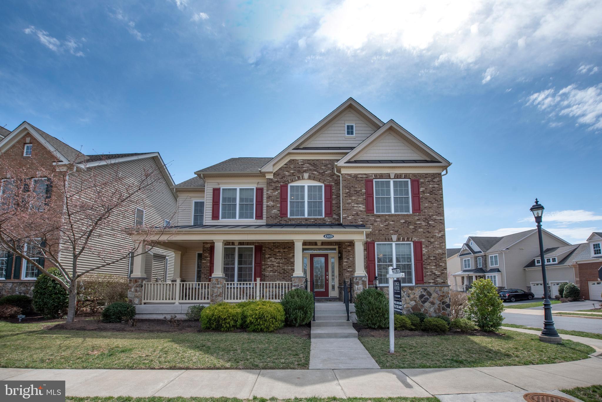 Welcome Home! Discover this stunning, freshly painted Merrifield model in the sought-after Moorefield Station community, offering nearly 4,600 finished square feet across three beautifully appointed levels.         

MAIN LEVEL -Step from the expansive covered front porch into the welcoming foyer. To the left, a private office with French doors provides a quiet retreat for work or study. To the right, the spacious formal dining room is perfect for hosting large gatherings. This level boasts rich hardwood flooring, crown molding, and chair railing. The huge great room with cozy gas fireplace, making it the ideal gathering space. The chef’s kitchen is a showstopper, equipped with stainless steel appliances, a double oven, granite countertops, 42" custom cabinetry, a breakfast island, and recessed lighting.  The breakfast area with deck access allows natural light to pour in, creating the perfect setting for morning coffee or evening entertaining.        
           
UPPER LEVEL The expansive primary suite is a true sanctuary, highlighted by a separate sitting area, a tray ceiling with a ceiling fan, and a large walk-in closet with custom organizers. The luxurious en-suite bath includes a dual vanity with granite countertops, a soaking tub, a separate shower, and a linen closet. Bedrooms 2 and 3 share a convenient Jack-and-Jill bath, while Bedroom 4 includes another private en-suite bath. The upper-level laundry room is outfitted with washer and dryer, and extra storage for added convenience.  
           
LOWER LEVEL The fully finished lower level offers exceptional flexibility, featuring a spacious recreation room with recessed lighting, another full bathroom, rough-in for wet bar, and an ample storage area.      

PRIME LOCATION Situated just 1 mile from the Ashburn Metro station, Moorefield Green features top-tier amenities that include a clubhouse with fitness center, club room, pools, and tot lot, and walking trails & pocket parks throughout. 
This community is a pedestrian-friendly enclave within walking distance of shopping, dining, and top-rated schools, medical facilities and much more! With easy access to major commuter routes and Dulles Airport, easy access is effortless.

Don't miss this incredible opportunity - Schedule your tour today!
Special Financing Incentives available on this property from SIRVA Mortgage