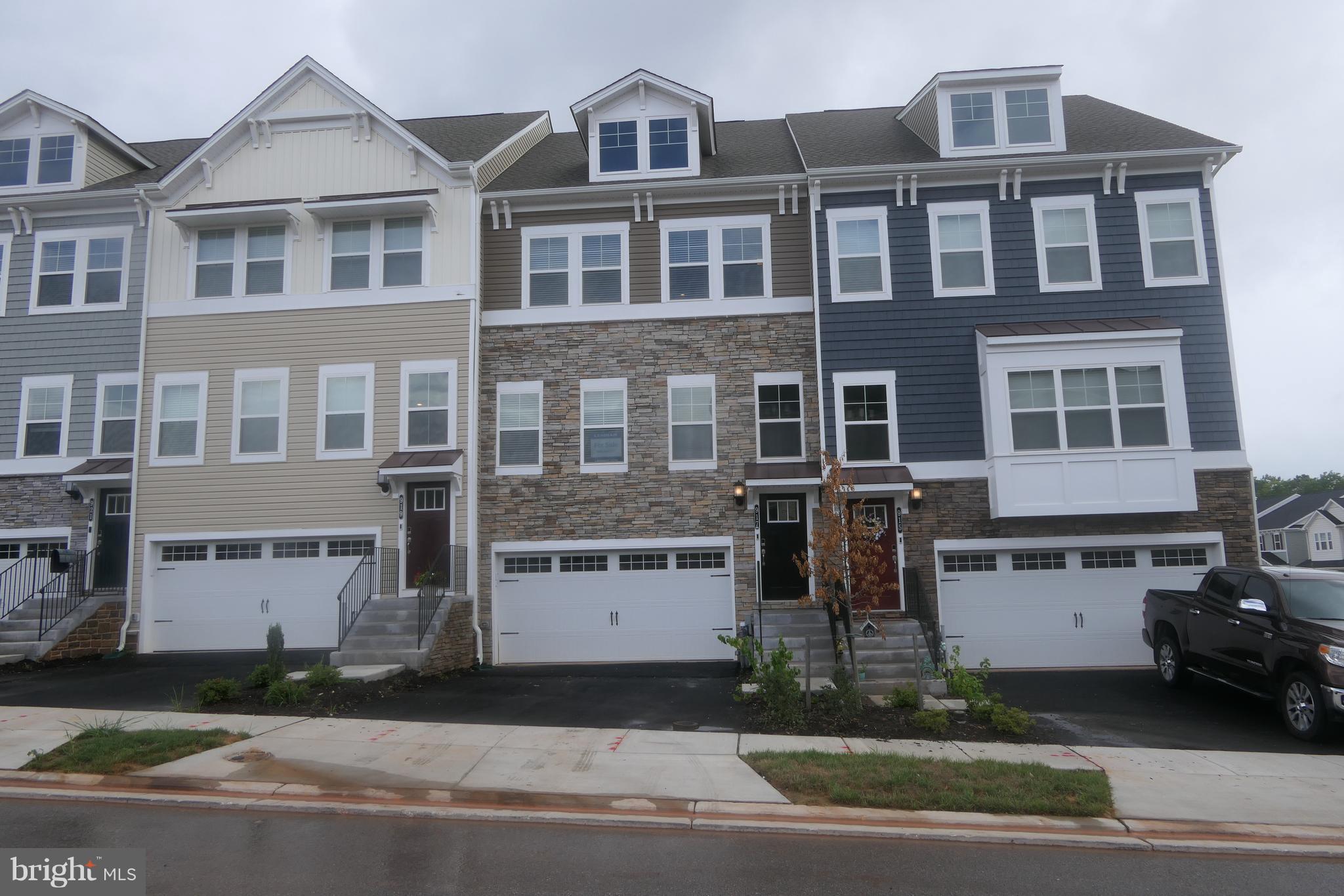22ft wide stone front townhouse is ready to move in!!!! 4 levels with wet bar and terrace. Stunning white kitchen with iced white quartz paired with white subway tile and light 7 1/2" wide durable plank flooring.  Home includes full bath on lower level, and wet bar in loft. Waterfront community with resort style amenities!!! Closing assistance with use of preferred lender/title