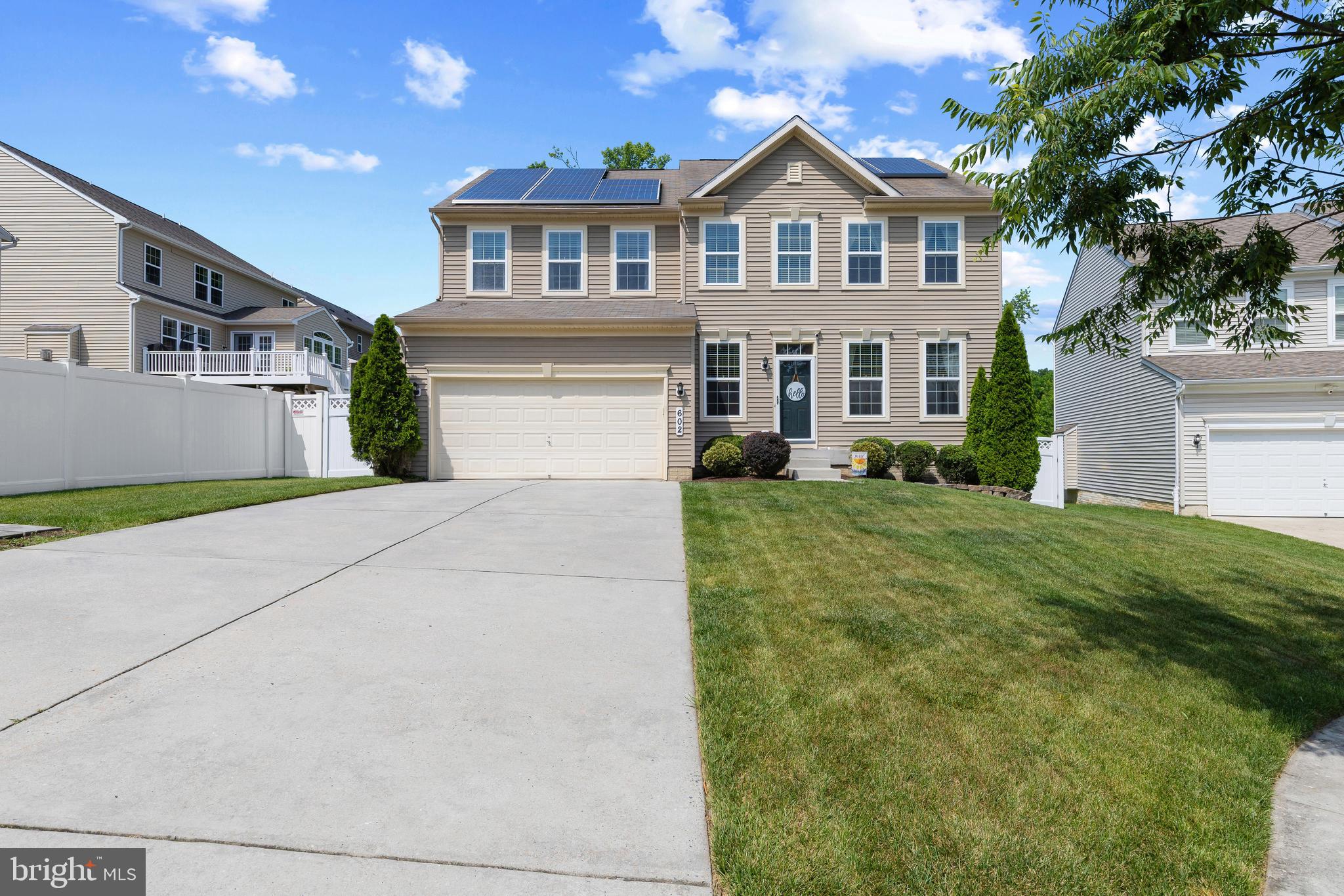 Welcome to 602 Laghman Court, a beautifully maintained colonial tucked away on a quiet cul-de-sac in sought-after Odenton. This spacious home offers three finished levels of living space, 4 bedrooms, 2 full baths, 1 half bath, and a 2-car garage. The main level features a gourmet kitchen with granite countertops, stainless steel appliances, maple cabinetry, and an oversized island that opens to the family room and sunroom, creating an ideal layout for everyday living and entertaining. A cozy fireplace adds warmth and character to the living space.

Upstairs, the expansive primary suite serves as a private retreat with a large walk-in closet and a luxurious bath featuring a soaking tub and separate shower. Convenient upper-level laundry and generously sized secondary bedrooms complete the upper floor.

The finished walkout lower level provides exceptional flexibility with abundant space for a recreation room, home office, fitness area, or guest accommodations. Lots of storage. The fully fenced back yard features a beautiful stone patio. Perfect for entertaining. Enjoy the benefits of a cul-de-sac setting while remaining close to shopping, dining, commuter routes, Fort Meade, MARC rail service, Baltimore, Annapolis, and Washington, D.C. This home combines space, comfort, and convenience in one outstanding package.