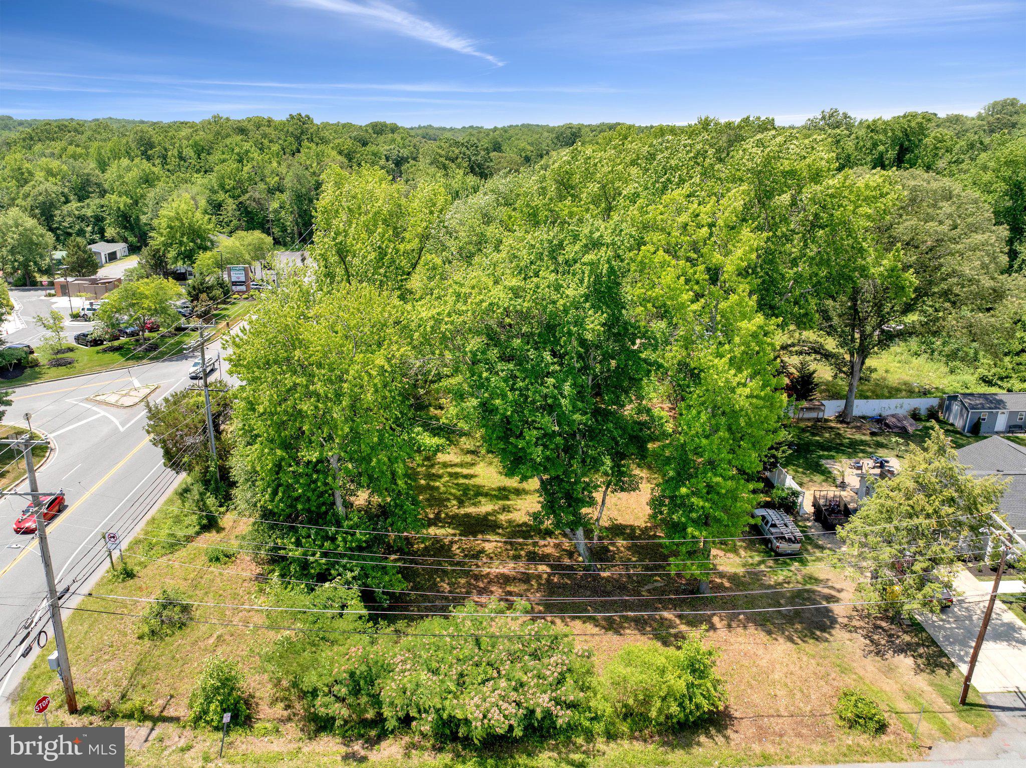 This mostly cleared property offers flexible potential under new multi-use commercial zoning, with residential use also permitted. The offering includes two parcels, preferably sold together, creating an opportunity for coordinated planning, future use, and long-term value. Parcel 3424 includes approximately one acre with an existing non-operable well, septic system, and electric service already in place. The second parcel adds additional frontage and flexibility. Together, the parcels form a corner site positioned among established businesses and residential properties. Subject to zoning and local approvals, possible uses may include townhomes, single-family homes, medical or professional office space, or neighborhood commercial services. A planned subdivision across the street may contribute to future area activity and growth. Bring your vision to life on this remarkable site. Whether planning homes, offices, or a neighborhood gathering place, this property offers a rare opportunity to create something meaningful in a growing area.** Please do not enter the home. Due to the condition of the property, there may be safety concerns. If you are interested in viewing the home, please contact the listing agent directly to schedule a showing.**