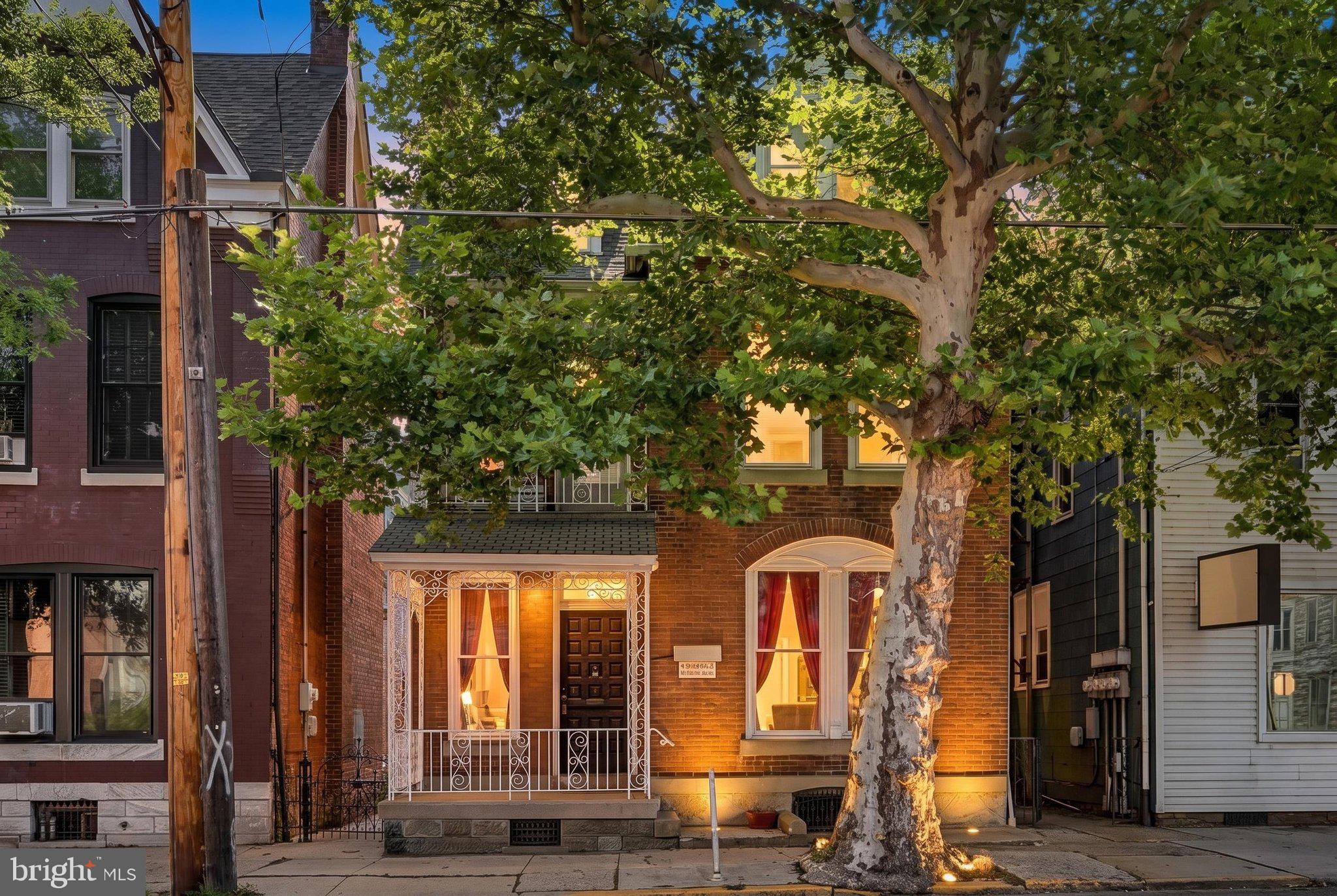 Step into a piece of Pine Grove history with this beautifully preserved brick single, showcasing stunning original chestnut woodwork, original hardwood floors, and timeless architectural details throughout. This amazing Pine Grove home was owned by the same family for over 70 years.  The grand foyer welcomes you with a beautiful wood-burning fireplace, a breathtaking open staircase, and a stunning stained-glass window that fills the home with character from the moment you enter.
The unique front entrance offers two separate access points, one leading to what was originally  law office. Complete with a waiting room and private office, this flexible space is ideal for a home business, studio, or whatever your imagination envisions.  So many amazing details including a beautiful wood burning fireplace in the office.  A convenient powder room is tucked beneath the staircase.
The spacious living room features oversized windows, generous closet space, and beautifully preserved hardwood floors. The formal dining room, once the home’s original kitchen, is perfect for entertaining. The updated kitchen offers abundant cabinetry, a wall oven, cooktop, dishwasher, and refrigerator.
Upstairs you’ll find three spacious bedrooms, including a large middle bedroom, all offering impressive closet space. An additional den opens to a private balcony, while the bright sunroom overlooking the backyard creates the perfect reading nook, hobby room, or home office. A full bath completes the second floor.
The walk-up attic provides exceptional storage with exciting potential for a future recreation room, additional bedroom, or playroom. The full basement spans the footprint of the home and offers extensive shelving and storage space.
Outside, enjoy the welcoming front porch, a beautifully landscaped flat backyard with mature grapevines, a charming gazebo, and a detached garage. A picturesque walkway with a wrought-iron gate leads from the backyard to the front of the home, adding even more charm to this one-of-a-kind property.
This remarkable home offers the rare opportunity to own a piece of local history while enjoying generous living space, unmatched craftsmanship, and endless possibilities.  Call today to set up a private showing of this historic beauty!