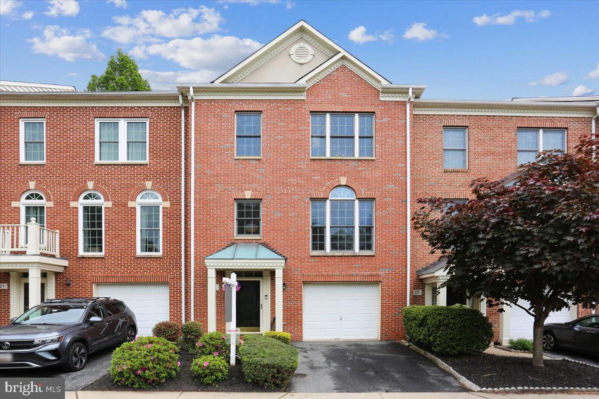 Stunning 3BR/3.5BA brick-front luxury townhouse with covered front portico and bump-outs in the rear built by Winchester Homes.  Over 2,350 square feet of living area on three levels plus a one-car garage just minutes from Metro’s Red Line. Special features include wide-plank hardwood flooring throughout most of the main and upper levels, 18-inch diagonally laid ceramic tile flooring in half of the main level, custom painting, 9-foot, cathedral, and vaulted ceilings, remodeled gourmet kitchen, renovated bathrooms, upgraded lighting, and window treatments throughout. Gorgeous private backyard comprised of a composite deck, fenced yard, and professional landscaping backing to common area.  Concrete walkway and front stoop; open two-story foyer entrance with recessed lighting, hardwood flooring, and solid oak staircase with designer carpet runner; living room and dining room with recessed lighting, crown molding, chair rail, and floor to ceiling windows with Palladian transom above; overlook to foyer with powder room around corner; open kitchen floorplan with 42-inch maple cabinets, granite countertops, designer ceramic tile backsplash, upgraded appliances, granite center island/breakfast bar with downdraft cooktop, pendant and recessed lighting; family room off of kitchen with recessed lighting and ceiling fan; sunroom with floor-to-ceiling windows, ceiling fan and new double French doors to rear deck; master bedroom suite with cathedral ceiling, ceiling fan, and walk-in closet with custom built-ins; renovated master bathroom with cathedral ceiling, designer 18-inch ceramic tile flooring, double granite vanity with undermount sinks, oversized walk-in shower with bench seat, shelf niches, mosaic borders, and frameless glass enclosure; two additional bedrooms with ceiling fans and closets with custom built-ins; upper hallway landing with hardwood flooring and remodeled hall bath with designer 13-inch ceramic tile flooring, double granite vanity with undermount sinks, two three-light vanity lights, and tub surround with matching designer wall tile; lower level recreation room with designer carpeting, corner gas fireplace and recessed lighting; wide-cased opening to den/exercise room with track lighting and new rear access door to walk-up exit; full ceramic tile bath, laundry room and storage under stairs.  Without leaving the neighborhood, there are over a mile of bucolic walking/bike paths, forested conservation areas, sidewalks, two tot lots, a private tennis court, and a basketball court.  Adjacent to the development sits the City of Rockville's Bullard Park at one end of the neighborhood and all of the sports fields, track, and tennis courts of Julius West Middle School on the other side.  Be part of the vibrant Rockville Town Center featuring shopping, fine restaurants, sidewalk cafes, the Rockville Regional Library, Regal Cinemas, and other entertainment and cultural facilities.  Less than a mile from the Rockville Metro (Red Line) for those looking to commute via mass transit.