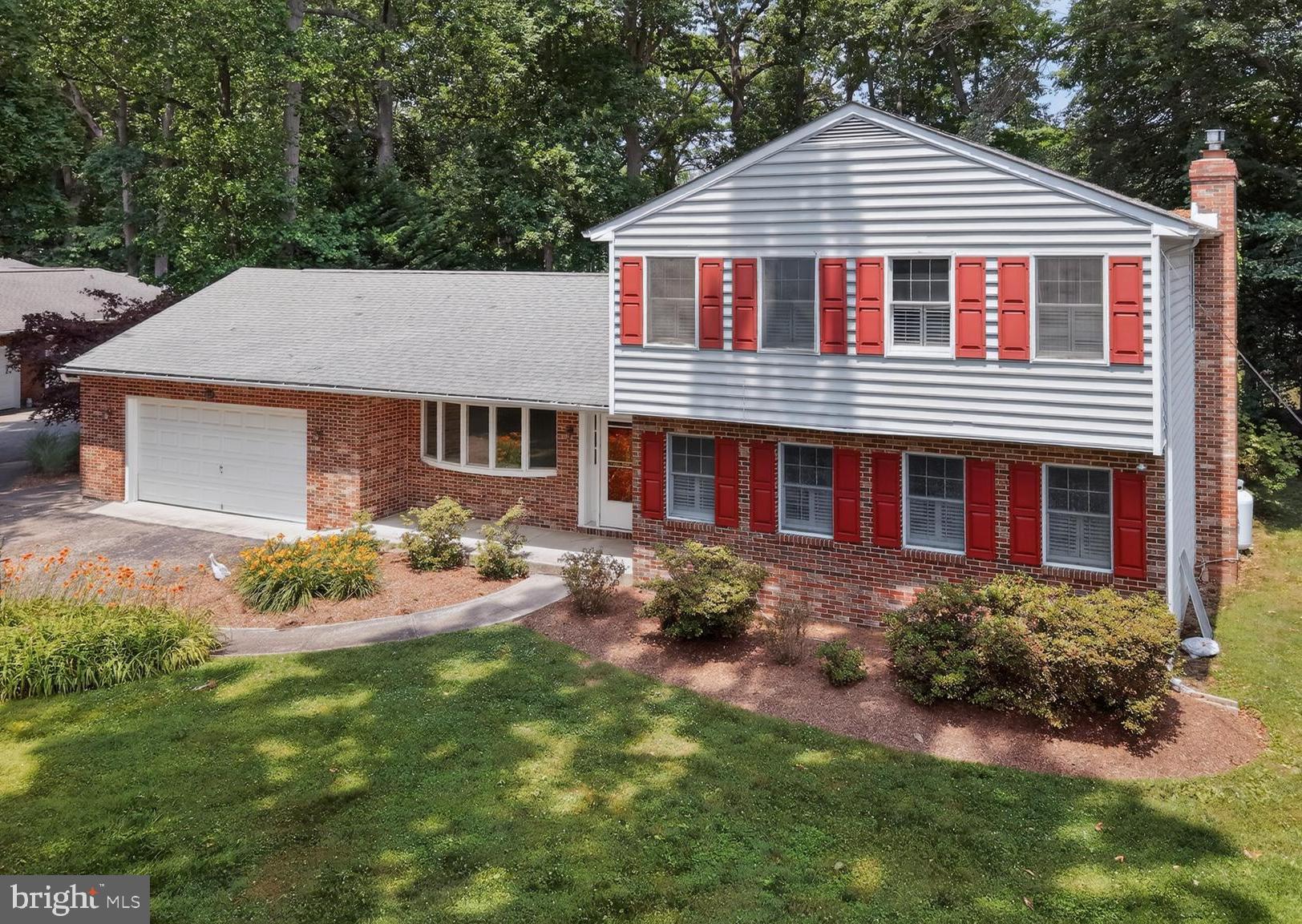 Don’t miss this rarely available 4-bedroom, 2.5-bath Colonial in the highly sought-after, water-privileged community of Amberley. Fresh paint and abundant natural light create a warm and inviting atmosphere throughout. The kitchen is filled with natural light and offers gray-toned cabinetry, recessed lighting, a sunny breakfast area, and peaceful tree-lined views. Perfect for both everyday living and entertaining, the spacious family room offers a cozy gas fireplace with a charming brick surround, custom built-ins, and direct access to the rear covered porch. Overlooking picturesque Whitehall Creek, this tranquil outdoor retreat provides the perfect setting to gather with friends or unwind while taking in the serene waterfront scenery at any time of day. Just beyond is a versatile formal dining area framed by lovely front lawn views. Whether hosting memorable dinners, creating a cozy sitting room, or using the space as a private home office, this room offers flexibility while enjoying a peaceful scenery. A nearby powder room and laundry room add convenience and functionality. Retreat upstairs to the spacious primary suite, where large windows adorned with plantation shutters fill the room with natural light. The walk-in closet is thoughtfully outfitted with a custom organization system, while the en-suite bath offers a tiled walk-in shower, creating a comfortable and private retreat at the end of the day. Three additional bedrooms, each with ample closet space, share a well-appointed hall bath with a tub/shower combo, completing the upper level. The unfinished lower level provides abundant storage space and shelving with the possibility for future expansion if finished. An attached two-car garage, complete with a built-in workshop, is ideal for hobbyists, DIY enthusiasts, or extra storage needs. An extended driveway offers ample off-street parking for 4+ cars. With nature as your backdrop, this spectacular 29,500 sq ft lot is an entertainer's dream. Create your own private oasis with breathtaking riverfront views and a meandering pathway leading to your private boat slip. Enjoy endless opportunities to relax or entertain outdoors, from cozy evenings around the firepit on the brick patio to peaceful mornings surrounded by mature trees that provide beauty, privacy, and a serene setting year-round. Amberley's exceptional amenities further enhance this waterfront lifestyle. Residents enjoy access to three community piers with 45 boat slips, kayak and dinghy racks, a kayak launch pier, and a boat ramp. In addition, more than 15 acres of preserved forest and open fields offer walking trails and scenic vistas, making this a truly special place to call home.