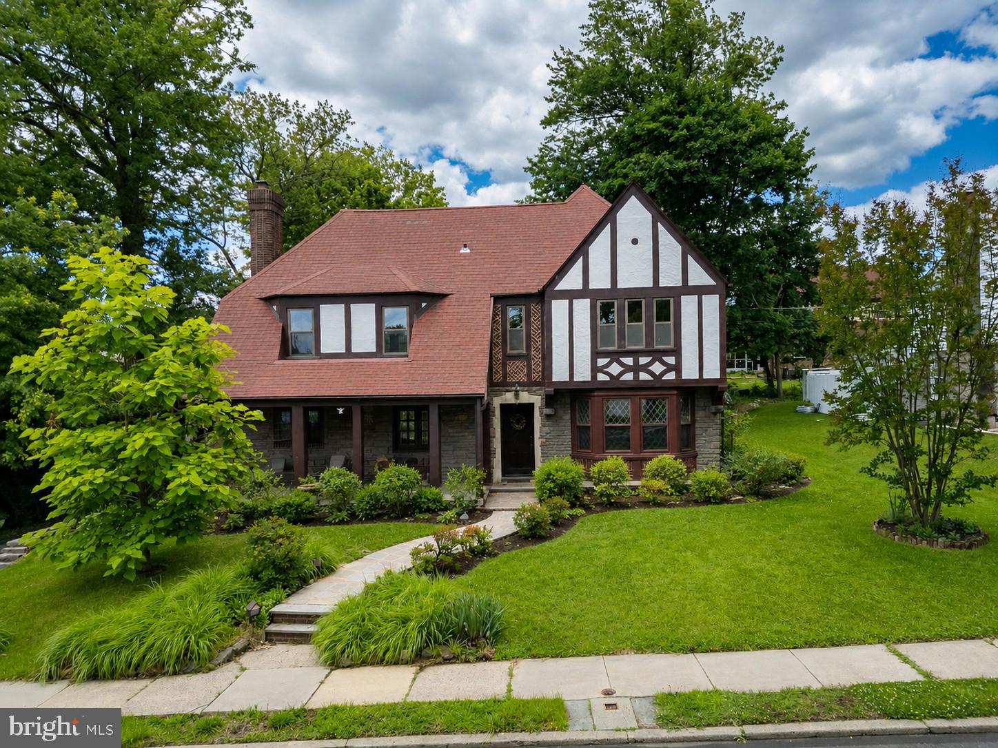 The wait is over! A stunning & architecturally pleasing  5 BR, 4 1/2 BA stone, stucco & brick English Tudor home  in the sought after Drexel Park  section of DH has just entered the ranks of "active" status.  (DP just celebrated it's Centennial in 2024.)The 2 zones of high velocity CA will be most welcome. The  Lennox upstairs unit was installed 4/26. This home has all the "I want's "- size, well planned layout, timeless elegance, amazing period amenities, a 2-car attached garage ,a driveway for 8+ cars and it boasts authentic, welcoming curb appeal! Some not often seen original touches include several sets of French doors in the LR & DR, random width pegged floors on the 1st level, well-cared for hw's on the 2nd & 3rd floors, a door recessed into the back wall of the house where the milkman could leave the milk, a laundry chute , a PR in the hallway, interesting placement of the recessed radiators , many closets w/automatic lighting as you open & close the doors, & a back staircase off the kitchen that leads to the au pair quarters w/it's own full BA on the 2nd floor. Two BR's share a Jack & Jill bath. The 4th BR is carpeted. The 3rd floor is finished into a decent-sized space with a full BA & W/I closet. The possibilities for this room  are endless-5th BR, office, exercise room. You decide! At the end of the front flagstone pathway, the 'chevron-styled' original front door w/stained glass opens to the lovely center hall & stained oak staircase.. The  4 diamond-shaped, lead glass, formal  DR front windows are a sight to behold! The DR is so large that any size set would fit here w/no issues. The handles on the amazing 8-panel doors are either crystal, ceramic or very unique hammered silver (quite unusual). The spacious & gracious primary en-suite BR boasts 3 closets-one being cedar. The baths have original ceramic tile & deep tubs, however, upgrades have been made  to fixtures & flooring in many cases. The month of June, 2026 brought 2 terrific upgrades to #522. The stucco was just painted, & the  brick-colored architectural roof got a professional roof wash.  Also, it hasn't been too long ago that the stone & brick on this home was hand pointed. The facade truly sparkles! The many windows in the oversized LR, which boasts a stone, gas FP w/a remote, bring in lots of natural light. There are receptacles carefully placed on the mantel over the bookcases that flank the FP for some added lighting for your holiday decor. The covered flagstone open front porch can be accessed by yet another set of French doors from the LR. Serenity comes to anyone who spends some time here. The kitchen, w/it's blend of traditional & modern features, is quite large.  It shows off a period, wood-stained vintage display case/ breakfront, as well as loads of cherry cabinetry &  a good-sized  granite-topped island w/embedded cook-top. The backsplash is also granite, The appliances are stainless, & include a  double oven, & the flooring is luxury vinyl plank. Just a few steps from the kitchen to the attached 2-car garage that houses a spare fridge. The new garage door ('26) comes w/a remote. There's a space out back to sit &gaze at the calming koi pond. The unfinished bsmt has several sections. The Dunkirk 75,000  BTU boiler ($17K) &  50 gal. Bradford White hot water heater are gas -fired. The electric is 200 amp circuit breakers. There is a roughed in area for a PR in the bsmt. All the window wells are covered w/wood. There are deep tubs in all the baths. For an optional $35/yr. you can join the DP HOA & participate in the many seasonal events, like Easter Egg hunts, Holiday House tours, Fall Festivals, yard sales, 4th of July parades, May plant swaps & Spring Socials.,..a great way to meet the neighbors! All the street signs are signature green in 'The Park'. Use trolley service to CC  & Media! FREE 1yr HOME WARRANTY! The UD Performing Arts Center & the Lansdowne Theater are close by, as well as schools, shops, eateries & 3 large food stores.  WOW!
\