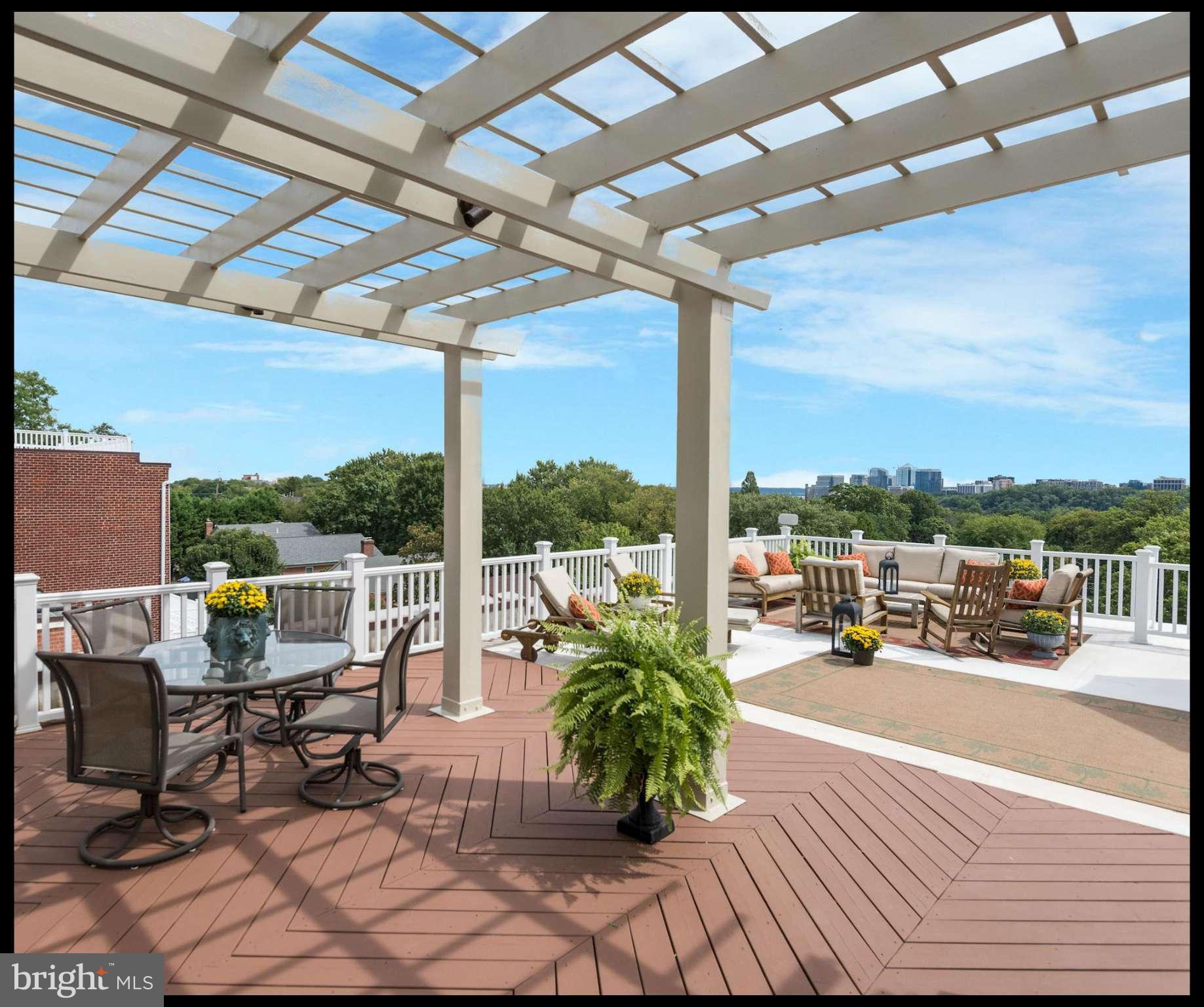 This property is DRAMATIC! Impressive scale w 10' ceilings, jaw-dropping roof deck w Monument & Rosslyn views, huge windows fill house with light, 5BRs, 4f & 2h BAs, 7600 sf on 5 levels, 4+ car Garage, elevator, spacious MBR renovated w His & Her Baths and walk-in closets. Turn-key move right in condition! Secluded yet convenient location w easy access to dwntwn, VA, MD. MUST SEE!