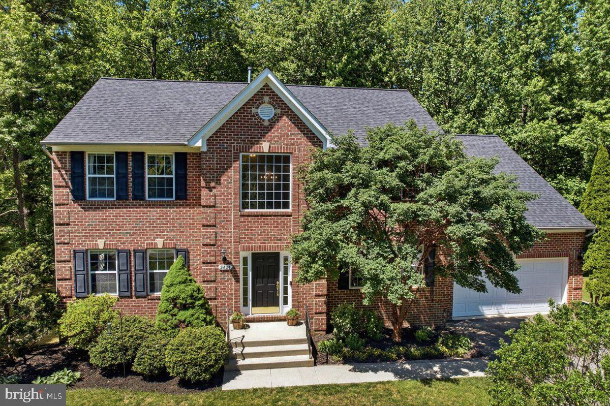 Classic Colonial Beauty in Calvert County, MD! Located within the charming community of Hunting Creek Knolls in Huntingtown, MD - this exceptional 5 BR, 3.5 BA residence showcases timeless architecture, thoughtful updates & an outdoor setting that feels worlds away from the everyday. Surrounded by mature woodlands, landscaped grounds, and well-designed living spaces, this home offers both privacy & connection to nature while remaining close to everything Calvert County has to offer. 

A stately brick front elevation accented by elegant keystone architectural detailing creates a memorable first impression. Mature trees embrace the property along the sides and rear. Across the street, additional wooded views enhance the sense of privacy and tranquility. A 2-car attached garage, paved driveway with turnaround parking area, and meticulously maintained landscaping featuring rose bushes, hydrangeas, cherry trees, arborvitae, dwarf spruce, Leyland cypress, and paperbark trees further elevate the home’s curb appeal.

Step through the front door into a soaring two-story foyer. 5-inch hardwood flooring flows throughout the main level. To the left, a versatile formal living room or home office showcases plantation shutters and upgraded crown molding details. To the right, the dining room offers lovely views of the front yard and wooded surroundings, creating a bright and inviting setting for time shared with family and friends. 

Beyond the foyer, open-concept living is defined. The family room is anchored by an energy-efficient pellet stove & flows seamlessly into the kitchen & breakfast area. The kitchen features granite countertops, stainless steel appliances and a center island with counter-height seating. A sliding glass door leads to the composite deck with vinyl railings and steps to grade. 

From the deck, enjoy elevated views before descending to the paver patio walkway and private, level side yard. Carefully curated plantings and mature trees create a landscape rich in seasonal beauty. Beyond the lawn, the property transforms into a private wooded escape. Nature trails invite exploration beneath the tree canopy, while a natural clearing provides the perfect location for a future fire pit or outdoor gathering space. Enjoy evenings under the stars, fireside conversations, quiet reflection, and the sights and sounds of nature. 

Inside, interior features continue to the impressive owner’s suite featuring a soaring cathedral ceiling & space for a sitting area. Dual walk-in closets frame the hallway leading to the private owner’s bath, recently updated with ceramic tile flooring, a dual-sink vanity with sleek quartz countertops,  a deep soaking tub and a spacious ceramic-tiled shower complete with frameless glass enclosure and built-in bench seating. The secondary bedrooms are generously sized and enjoy peaceful wooded views. They share a recently renovated hall bath featuring a raised-height dual sink vanity with quartz countertops and a tub/shower combination with ceramic tile and decorative mosaic accents.

The fully finished lower level expands the home’s living space even further. Luxury vinyl plank flooring extends throughout. The recreation room offers endless possibilities for entertaining, gaming, movie nights, or relaxing. An exercise room or flex space provides versatility. An updated full bath and adjacent bedroom create an ideal guest suite for overnight visitors or extended stays. Laundry access is conveniently located nearby. Thoughtfully updated, this home offers the rare combination of timeless design, flexible living spaces, and meaningful improvements. In addition to a 2023 roof replacement, the owners recently installed a new well pressure tank. Propane heat, quality finishes, and pride of ownership are evident throughout. 

Served by Calvert County’s highly regarded school systems & located nearby to commuter route 4, & all the natural beauty that makes Calvert County such a special place to call home.
