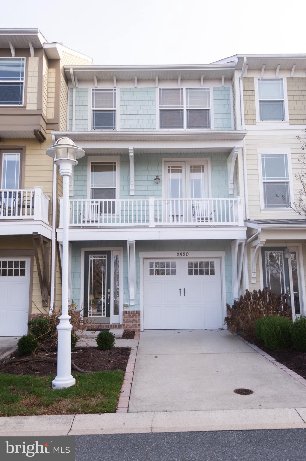 Experience resort-style living at an exceptional value in the Residences at River Marsh. Perfectly positioned between the Hyatt Chesapeake Bay Golf Resort, Spa & Marina and the award-winning River Marsh Golf Club, this beautifully maintained 4-bedroom, 3.5-bath townhome offers the ideal blend of waterfront recreation, golf course views, and luxury amenities on Maryland's Eastern Shore.

Located just a short stroll from the marina on the Choptank River, boaters will appreciate the opportunity for annual marina memberships with slips available to keep your boat in the water and ready for your next adventure. Golf enthusiasts will enjoy front-row views of the 2nd fairway and 3rd hole from multiple outdoor living spaces, including a ground-level patio, screened porch, and private balcony off the primary suite.

Inside, the thoughtfully designed three-level floorplan features hardwood flooring, a spacious center-island kitchen with stainless steel appliances, breakfast bar seating, dining area, and an inviting living room ideal for entertaining family and friends. A front porch overlooking the Hyatt grounds offers glimpses of the marina and resort atmosphere that makes River Marsh one of the Eastern Shore's premier destinations.

The upper-level primary suite serves as a private retreat with balcony access, customized California Closets, and an upgraded spa-inspired shower featuring body sprays, handheld wand, and traditional  shower head. Additional custom California Closets throughout the upper-level bedrooms and pantry provide exceptional organization, while updated lighting fixtures add a fresh, sophisticated touch throughout the home.

The attached one-car garage provides ample storage for golf clubs, bicycles, boating equipment, beach gear, and everything needed to enjoy the River Marsh lifestyle. Optional memberships are available for golf, community amenities, and select Hyatt resort privileges, allowing owners to tailor their experience to their interests.

Enjoy the convenience of walking to the marina, Blue Point Provision Company, golf course, resort amenities, and scenic waterfront trails. Whether you're seeking a full-time residence, weekend getaway, or vacation property, this is an outstanding opportunity to own in one of Cambridge's most desirable resort communities. Best of all, it is currently the best-priced townhome opportunity in River Marsh.