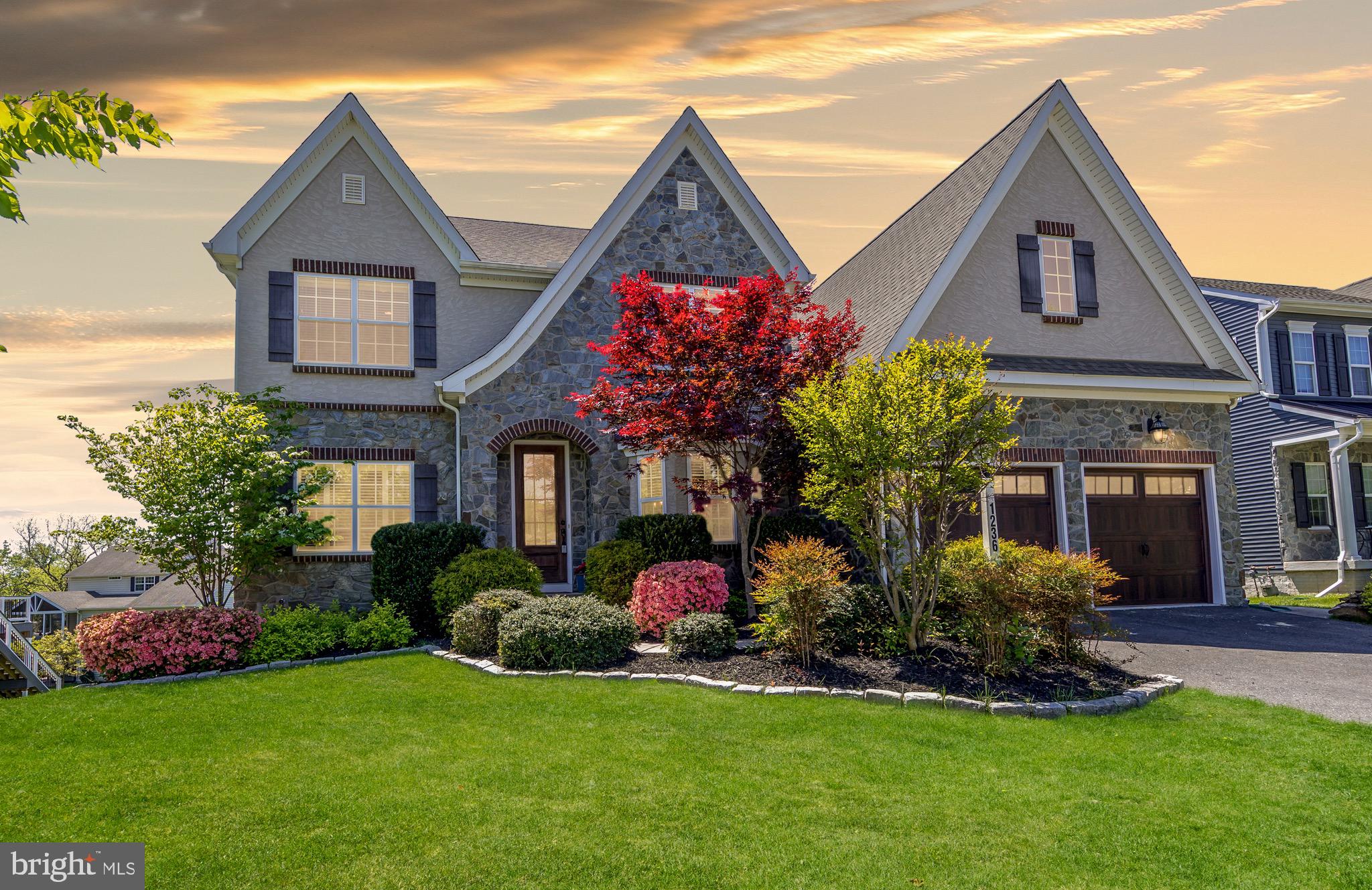 This stunning Keystone-built home combines luxury finishes, thoughtful design, and incredible living space throughout. Enjoy the exact high-end upgrades of the community's model home, plus two major bonuses: even more square footage and a fifth above-grade bedroom with a private ensuite bath.
This home features an open floor plan with wide-plank engineered flooring throughout. The kitchen is a standout, anchored by a massive island that overlooks the living area.  It is complemented by quartz countertops and stainless steel appliances.
For ultimate convenience, the primary suite is located on the main level. This private retreat includes a spa-inspired bathroom with a walk-in shower and two spacious walk-in closets.
On the upper level, you’ll find four additional bedrooms and a versatile loft, perfect for a secondary lounge or study space.  Every bedroom in the house is equipped with custom California Closets.
The living space extends outdoors to a covered porch featuring a two-sided gas fireplace, creating a cozy atmosphere for any season. The walk-out lower level is fully prepared for hosting, complete with a wet bar, a massive recreation room,  and direct access to the patio and backyard.
This home offers the perfect balance of high-end features and a functional layout for modern living.