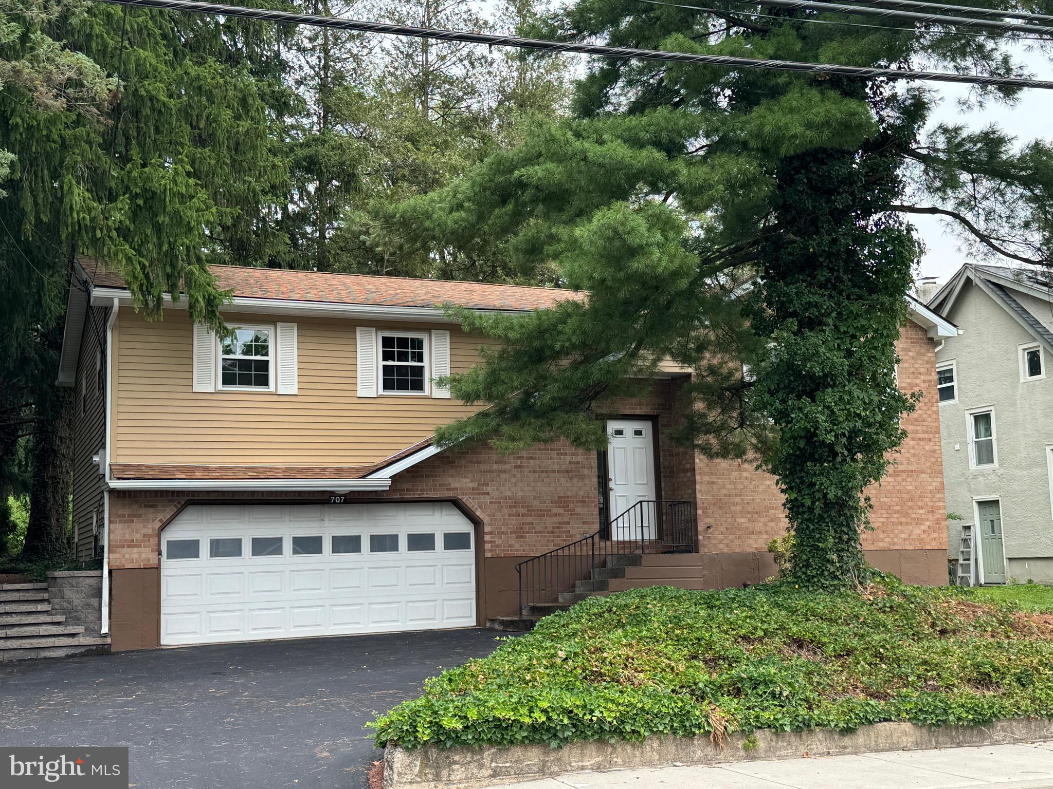 SHOWINGS BEGIN WEDNESDAY, JULY 15TH. WELCOME TO COOPERSBURG, A COZY LITTLE COMMUNITY WITH WARMTH AND CHARACTER! This home is so convenient to every thing you need, mostly within walking distance. Many updates such as the roof , gutters, facia, siding, windows, HVAC system, and water heater have taken place within the past 3-6 years. The kitchen features a new stove and new carpet in the dining room in July 2026. Also, the bathrooms have been updated with new toilets and flooring, and fresh paint in the main bathroom. The lower level offers a spacious family room with wood stove, a 4th bedroom with brand new carpet, and a half bath. From here you can access an oversized 2 car garage. There is a covered deck off the dining room that overlooks a private lot with mature trees. The home has been professionally cleaned , including windows and carpets. It has also been power washed on the exterior . Serviced by Southern Lehigh School District, there is an elementary school within walking distance. Schedule your appointment today while you still have an opportunity to make this home yours.