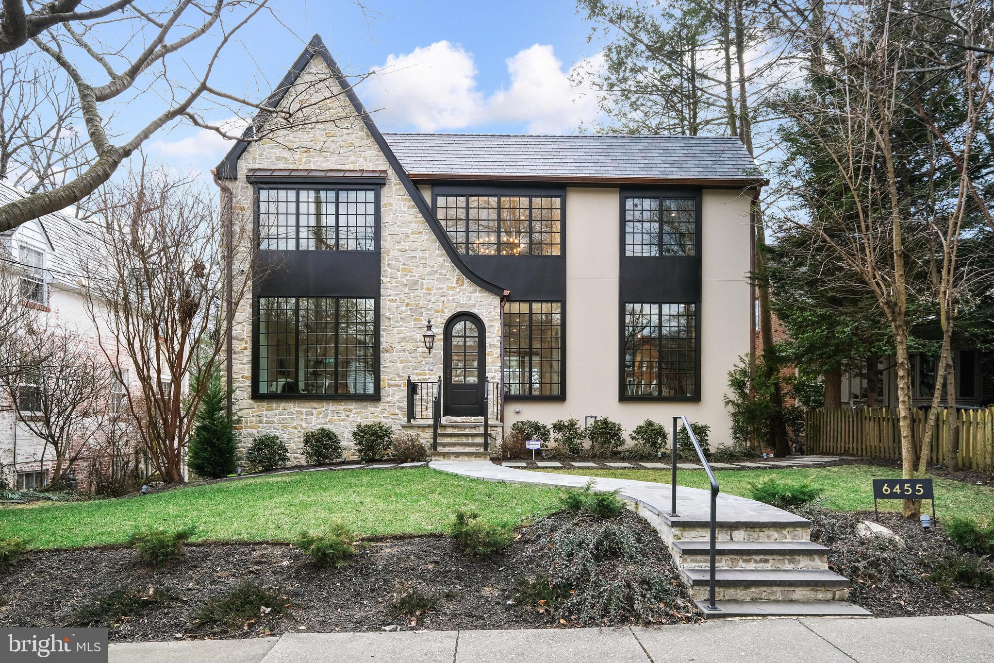 ***The highest recorded residential home sale of all time in Barnaby Woods***True luxury exists but rarely in the realm of domestic architecture.  This beautifully furnished residence is among the very few to offer the ideal complement of size, scale, materials, and features, making it one of the finest in Washington, DC.  This vernacular Tudor, in the heart of Barnaby Woods, was built c.1921, but has been completely re-imagined, re-built, and re-oriented in a way that maintains the feeling of its time, but presents a new spatial arrangement, simultaneously creating a sense of grandeur and intimacy.
          While a neutral palette has been introduced throughout the house, it is punctuated by bold details in black including the doors, tile, metal railings, lighting fixtures, and fenestrations.  This juxtaposition of elements imbues the entire composition with an energy that is palpable.  Oak floors on some levels live in harmony with polished concrete on others, and the play of natural light throughout the public rooms is enjoyed at all times of the day.
          Occupying three levels comprised of approximately 6,350 square feet, with five bedrooms, five full bathrooms, and one powder room, every member of the family will enjoy the pleasures of more than sufficient space, comfort, and privacy.  The luxurious principal suite features a private balcony overlooking the rear garden.  The marble tiled bathroom offers a Brizo dual shower, soaking tub, double vanity and custom walk-in closet.  The ancillary bedrooms are equally spacious and well-designed.
          The kitchen has been designed for maximum efficiency, yet with powerful decorative flourishes which make it a most engaging space.  Calacatta Vagli marble slabs, JennAir appliances including an Obsidian refrigerator and Pro Range make the entire kitchen as elegant as it is functional.  A beautifully outfitted butler's pantry with a beverage cooler and prep sink provides additional convenience.
          The lower level can provide any number of functions from entertaining on a large scale or serving as a special-function space.  It has a wood-burning fireplace, hand-carved stone mantel, and wet bar.  The entire rear of the house offers full-height views on all levels of an immaculately manicured garden, shaded by a canopy of mature trees.