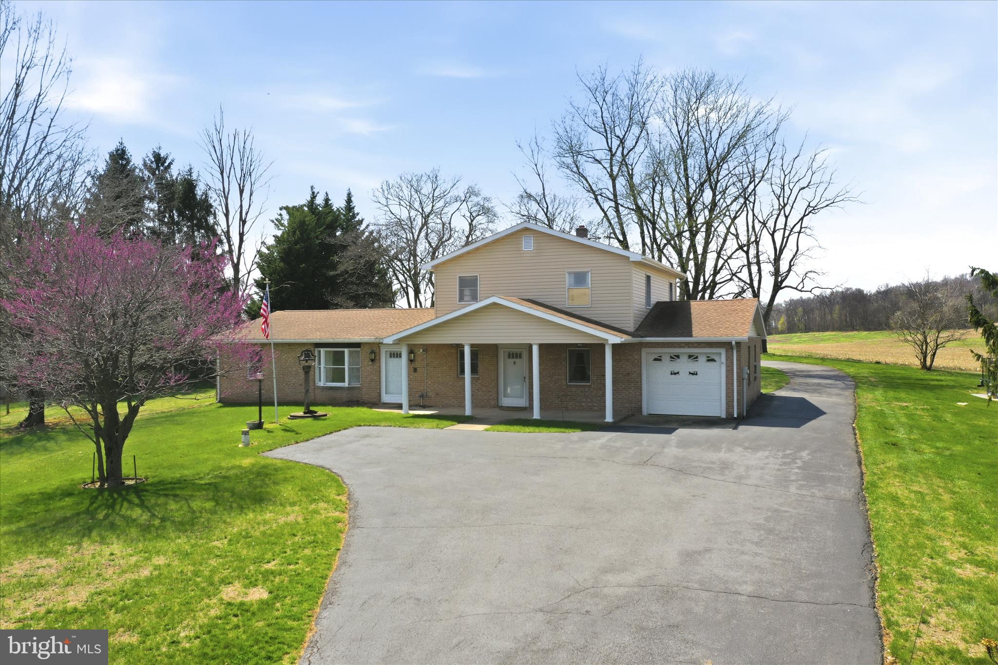 Discover the potential of this unique 3-bedroom 2-bath colonial home set on 1.36 scenic acres with beautiful pasture views, located within the desirable Smithsburg school district. This property offers a versatile layout and plenty of space for multi-generational living or rental possibilities. 
Originally a rancher with a thoughtfully added second level, the main floor features a comfortable living room, galley kitchen, and separate dining area. The primary bedroom includes a walk-in closet and a dual-entry full bath that also serves the hallway. A second bedroom and convenient main-level laundry.
Upstairs, you’ll find a fully functional in-law suite complete with its own kitchen, living room, full bath, and private bedroom—ideal for extended family, guests, or additional income potential. 
The exterior offers exceptional utility and storage, including an attached 1-car garage, a spacious driveway with ample parking, a storage shed, and an impressive detached 2-car garage large enough to accommodate an RV. The detached garage also features a dedicated woodshop/workshop area with a storage loft at the rear, providing excellent space for hobbies, projects, or additional storage.
Major updates include a heat pump and roof, both installed in 2018, new vinyl siding in 2018, and a new water softener installed in 2022. Enjoy rural living while still being within reach of everyday conveniences. 
A rare opportunity to own a property with space, flexibility, and incredible potential—bring your vision and make it your own! Schedule your showing today!