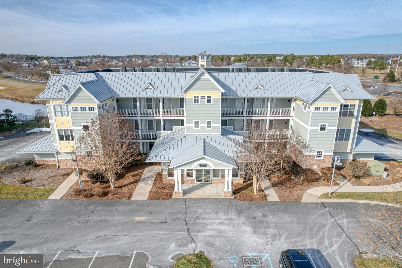 LOCATION LOCATION LOCATION - Welcome to the Windswept Condominiums in The Peninsula, Coastal Delaware's finest private country club community. A community with incredible amenities that you are beyond belief. This 2-bedroom 2-bathroom home with 1,700 square feet is available immediately. If you are looking for a second home, a primary home or a rental property this is the home for you.  You will enjoy amazing views of the sunrise over the Jack Nicklaus Signature putting green. You are just steps away from the Clubhouse and restaurant, and one of the three pools. The open concept flow works well for entertainment. The large well-equipped Kitchen with stainless steel appliances, granite counter tops flows nicely into the Living Room/Dining Area. This room has a gas fireplace, high end built-in cabinets and a ceiling fan. The patio with pergola is conveniently located right off of the Living Room. Off of the kitchen is a bonus room that can easily be used as a den/office and extra sleeping space when needed. 
The spacious primary bedroom also faces the putting green. The attached primary bathroom has a walk-in shower, soaking tub and dual sinks for your convenience. 

The home has luxury vinyl flooring throughout all rooms and crown molding to add a little more sophistication. The home also has a security system, electronic front door locking system, upgraded lighting and a remote thermostat. There are ceiling fans in all room areas. There is an additional storage room off the side of the home for bikes, beach chairs and other toys. There are 2 parking spaces that come with this home. One of them is deeded and across from the front door. Some furniture does convey with the sale. See the attached list of furniture. This home can be used as a rental for 7 days or more from Memorial Day through Labor Day and 3 nights the remainder of the year.. It is a very popular rental and rents easily. Club membership is required, with membership level at the buyer's choice. - Social, Sport or Reserve To be able to rent the home you need to have the Sports membership. Please see attachment and ask for details.

This is a very pet friendly community. The amenities are amazing at The Peninsula. This gated community offers, 24/7 Security Guard, Jack Nicklaus golf course, clubhouse, a nice restaurant, 3 pools, wave, adults-only, and indoor, newly refurbished fitness center, hot tubs, sauna, spa, game room, basketball, tennis and pickleball courts, a dog park, nature center, a private beach along the Rehoboth Bay, fishing pier, and miles of walking trails.  There is also shuffleboard, pickleball, billiards, full-service spa. You only need to leave the community for basic staples.

HOA & condo fees include Verizon FIOS Internet and TV service as well as common area & road maintenance, trash collection, 24/7 security, and contribution to long-term reserves for capital improvements and repairs. This home has been both a personal home and a rental unit. It is currently for rent. There are 3 weeks rented to date. These can be terminated if the new owner does not want rentals.