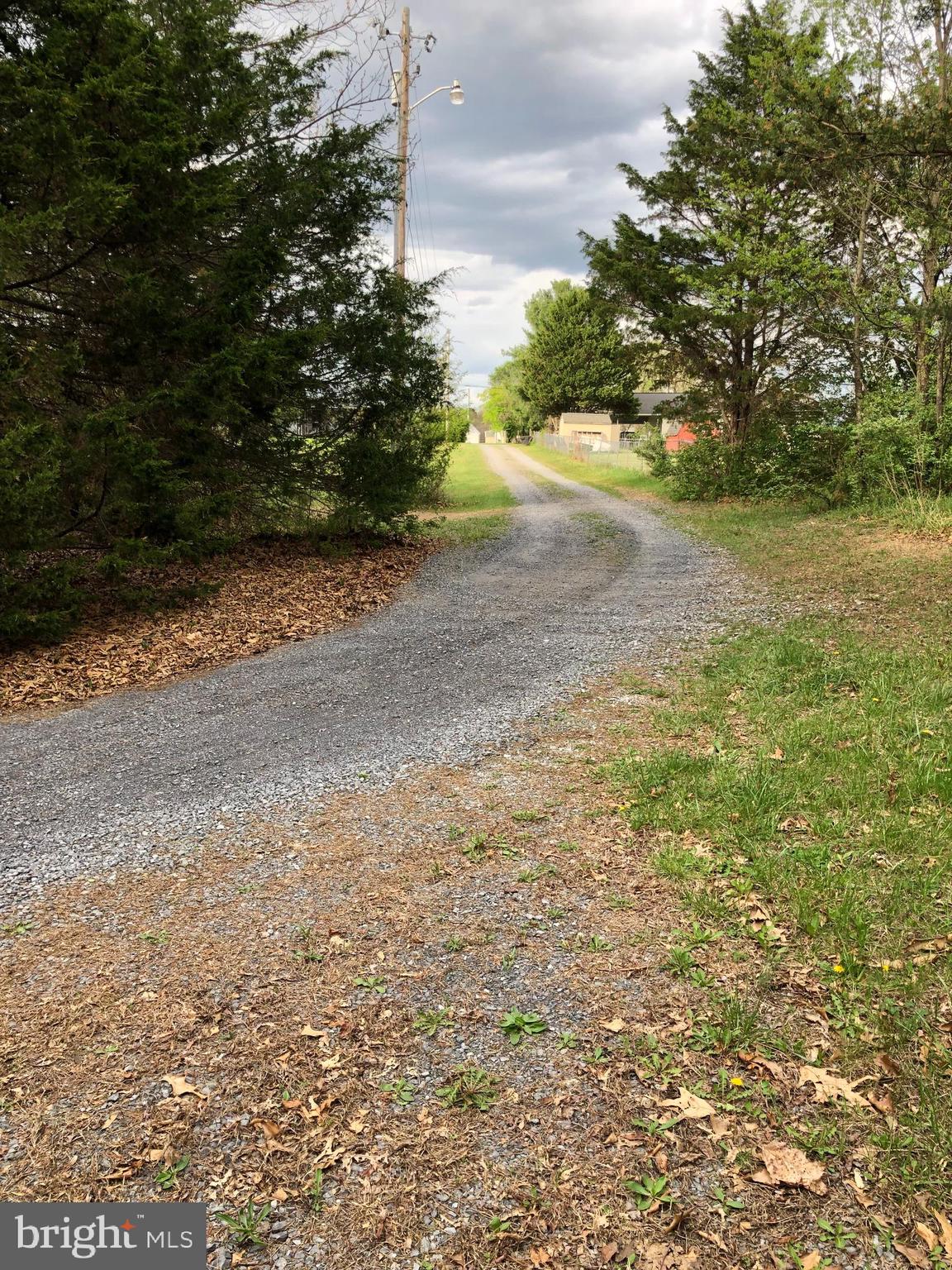 Build your dream home on this beautiful 5-acre wooded lot on Nadenbousch Ln., Inwood, WV. This buildable parcel offers privacy, natural surroundings, and the convenience of public water and sewer hook-ups available (cost to obtain) — a rare opportunity for land in this desirable area. Perfect for a custom home, weekend retreat, or investment property, this lot provides a peaceful setting while still being close to everything. Located in Berkeley County, this property offers easy access to Interstate 81, making commuting to Martinsburg, Winchester, and Hagerstown simple. Enjoy nearby shopping, dining, and entertainment, plus outdoor recreation at the Potomac River, Sleepy Creek Wildlife Management Area, and Poor House Farm Park. All sizes are approximate.