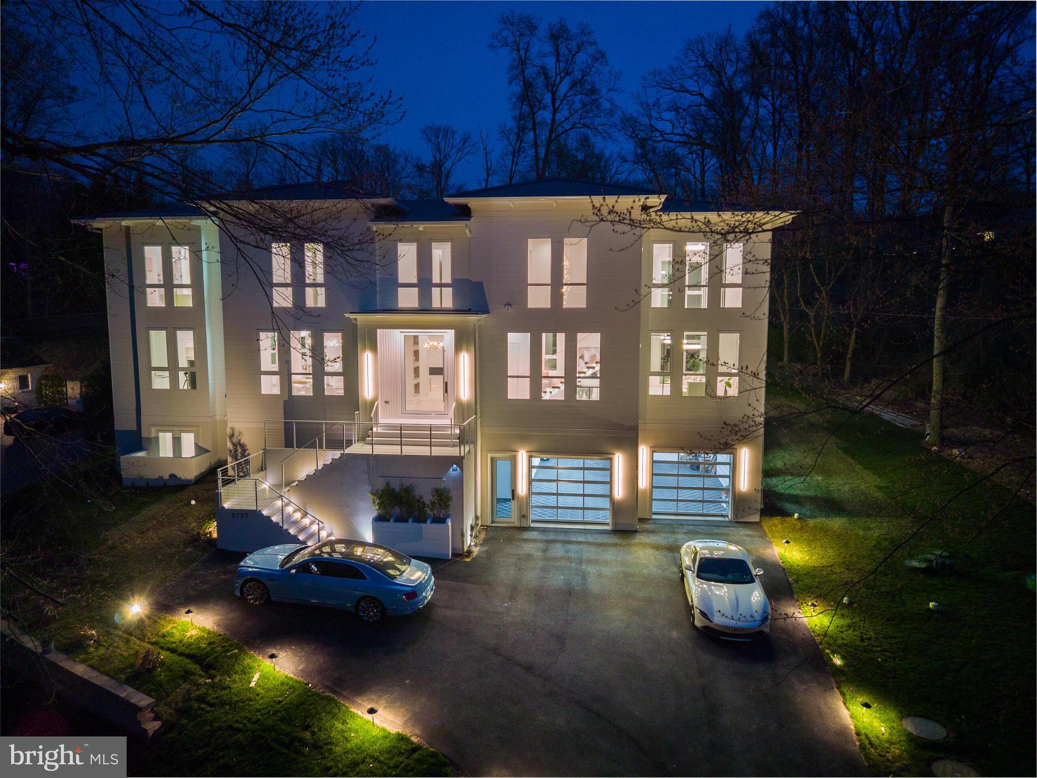 Offered at a compelling new price, this home represents a rare opportunity to own nearly 9,000 square feet of new construction in one of McLean’s most coveted settings. The scale, design, and craftsmanship, paired with partial lake views and protected surroundings, create an exceptional value that is seldom available. This exquisite California-style new construction home is an architectural masterpiece, and there is no possibility of future development to the right of the property overlooking the lake. This 6-bedroom, 7-bathroom home seamlessly blends modern elegance with warmth and functionality, featuring 12-foot ceilings, 10-foot doors, and an incredible 108 windows that flood the interiors with natural light while capturing picturesque partial lake views.  Step inside and be captivated by two elegant floating staircases and stunning white oak flooring that extends throughout the home. The regal gourmet kitchen is a chef’s dream, complete with a second butler’s kitchen for effortless entertaining. The bright breakfast room, formal dining room, family room, sitting room, and a private office with a full bath provide both grandeur and comfort. Four Montigo fireplaces are thoughtfully placed throughout, adding warmth and ambiance to the home’s sophisticated aesthetic.
The upper level boasts a lavish owner’s suite, complete with a private sitting room, elegantly separated by a custom fireplace, a bespoke walk-in closet designed with impeccable craftsmanship, and an opulent bath with heated floors. Three additional spacious bedrooms, each with its own ensuite bath, provide comfort and privacy.
A secondary family room and a separate office/lounge, uniquely divided by retractable sliding doors, offer versatile spaces for work, relaxation, or entertaining. A conveniently located laundry room completes the second level, enhancing both functionality and ease of living.
Designed for leisure and luxury, the lower level is a true retreat, featuring a state-of-the-art media room with 13-foot ceilings—perfectly suited for a golf simulator setup. This level also boasts a sauna, a recreation room with a fireplace and full wet bar, an exercise room, and a wine room.
This home is as functional as it is breathtaking, offering a 4-car garage equipped to support a lift for extra car storage—perfect for automobile enthusiasts.
A true architectural statement, this home delivers refined luxury, modern convenience, and complete serenity.  Located in one of McLean’s most prestigious neighborhoods, this home offers an unmatched location just 16 miles from Washington, D.C. It provides seamless access to both Reagan National Airport and Dulles International Airport and is less than 5 miles from the vibrant Tysons Corner hub. With major interstates nearby, commuting is effortless, making this an ideal residence for those seeking both luxury and convenience.  The seller is open to seller-financing options.
