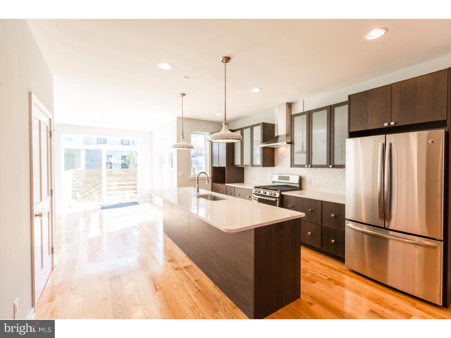 Stunning and sophisticated 3,100 sf new construction by Red Oak Development Group. Another outstanding property in 19125 with every thoughtful detail considered in design, function, and finishing choices. With 4 bedrooms each with their own unique special quality, and 2.5 baths. The first floor offers open floor plan with tons of natural light. The kitchen comes with 10ft kitchen island, quartz countertop, stainless appliances and white glazed tile in herringbone pattern for backsplash. You can walk right out through your slider glass doors to the backyard area. There is also a half bath and closet on this main floor. Walk upstairs to find 3 spacious bedrooms, laundry room and beautiful full bath complete with 8" gray hex floor tile and gray glass wall tiles. This bathroom offers a double sink vanity and linen closet. The third floor you will enter into the Master Suite. This oasis of a floor has a large master bedroom, with a walk thru closet and into your Master bath complete with marble tile, glass enclosed shower, double vanity and chrome mirrors. So much natural light with the skylights shining down through the stairs to the lower levels! Did we mention the fabulous roofdeck? And notice the wine fridge and bar sink with access to the deck off of the 3rd floor spiral stairs. Lighting fixtures throughout paired perfectly with elegant design sense. Finished basement and 10 year tax abatement included. We welcome your visit today!
