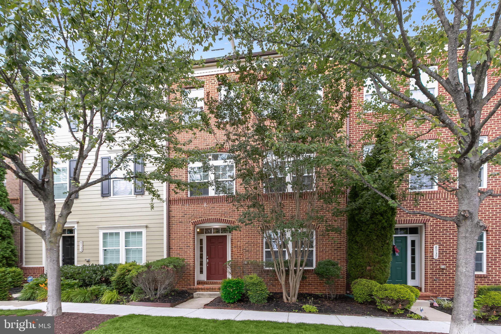 Welcome to this immaculate brick-front NV townhome in the coveted Maple Lawn community, where thoughtful design and upscale finishes align across three beautifully appointed levels. The entry level sets the tone with a welcoming foyer, a versatile office or guest suite with elegant French doors and an adjacent full bathroom, and a showstopping recreation room boasting soaring 14-foot ceilings — opening directly to a private paver patio and a two-car detached garage. The main living level impresses with rich hardwood floors throughout, formal living and dining rooms ideal for entertaining, and an airy, open kitchen featuring stainless steel appliances, black granite countertops, and a striking hexagon tile backsplash. French doors off the eat-in kitchen area invite you out to a spacious TREX deck — perfect for morning coffee or evening gatherings — while a conveniently tucked half bath completes this level. 

Upstairs, the luxurious primary suite offers two generous walk-in closets and a spa-inspired en-suite bath with a dual-sink vanity, soaking tub, and separate shower stall. Two additional bedrooms, a shared hallway bath, a dedicated laundry room, and a linen closet round out the upper level with every comfort in mind. This is refined townhome living at its finest. Conveniently located close to all major Baltimore/DC commuter routes, and with enviable amenities including a resort-style community pool, tennis courts, pickleball courts, basketball courts, walking trails, state-of-the-art gym and more — you’ll quickly see why Maple Lawn is an award-winning planned community unlike any other in the region.