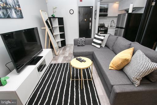 Welcome Home! It’s rare to find a designer gut renovated 1br-bedroom condo just steps from Rittenhouse Square at this price, Welcome to Unit 304 at The Walnut Plaza Condominiums, ideally located in one of Philadelphia’s most sought-after neighborhoods, just a short walk from UPenn, Drexel, top restaurants, cafes, and premier shopping. This bright and inviting residence features hardwood floors throughout, a gut renovated kitchen with subway tile backsplash, stainless steel appliances, and ample cabinetry for storage. Dishwasher, W/D combo unit and quartz countertops in this beautiful designer kitchen The gorgeous bathroom is accented with cararra marble throughout. Whether you're a first-time buyer, investor, or looking for a pied-à-terre in the city, run for this unique turn key opportunity. Agent has ownership interest