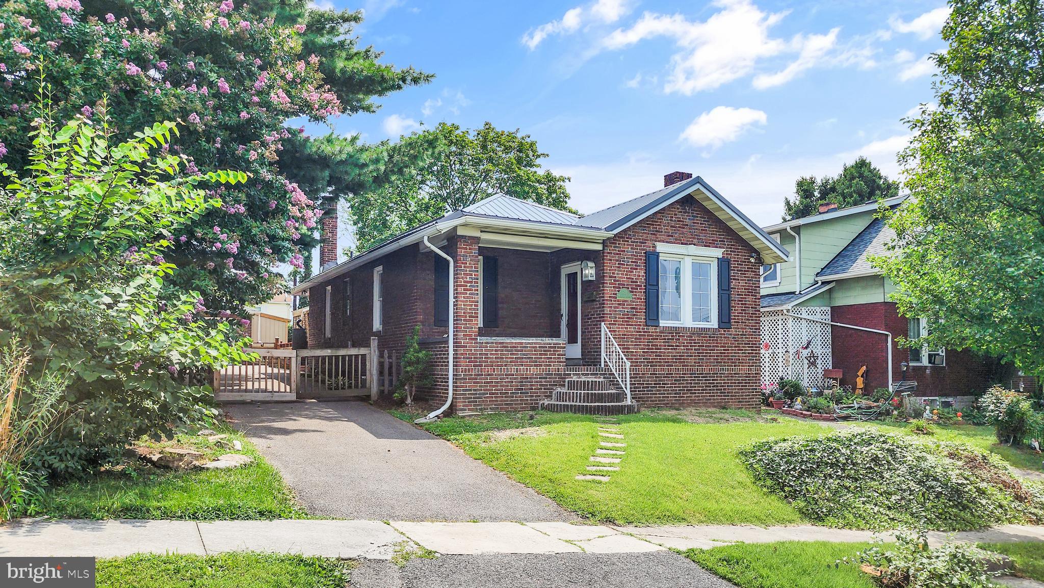 Charming Brick Home with Room to Roam!
This solid 2-bedroom, 1-bath home in Cumberland is full of surprises—from the cozy enclosed porch to the backyard deck perfect for entertaining. Inside, enjoy a mix of hardwood, vinyl plank flooring, and brand-new carpeting, a gas fireplace in the spacious living area, a separate dining room, and central A/C. Outside, you'll love the fenced backyard, 1-car detached garage, and a paved drive-through driveway with off-street parking for up to 7 cars! With a new metal roof and gas forced air heat, this one’s as practical as it is charming.