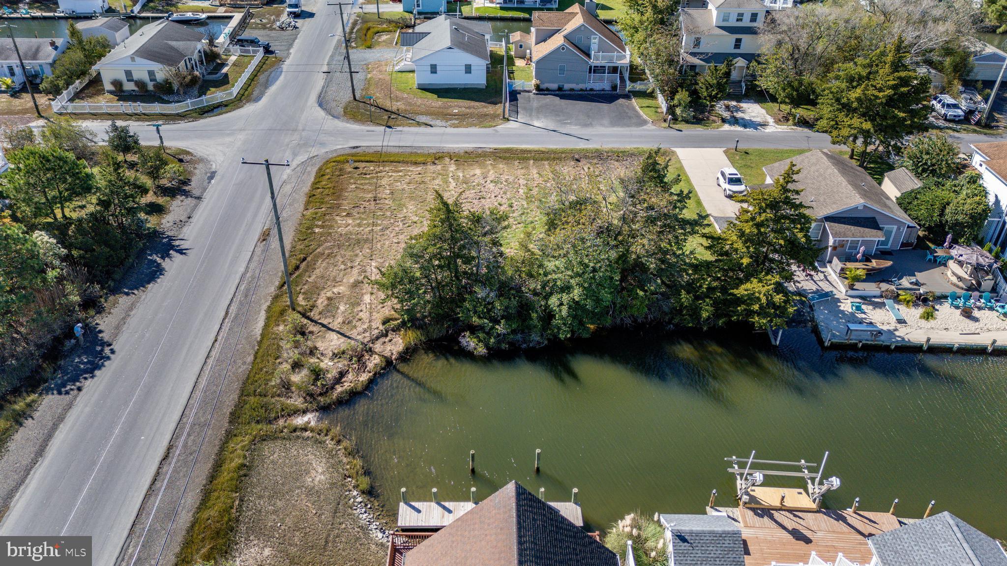 PICS ARE OF BOTH LOTS. We have now partnered with Bay To Beach Builders. Ask about our Home/Lot new home package!! Waterfront living at its best!! Waterfront building lot in much sought-after Cape Isle of Wight in West Ocean City. Corner lot #1. Direct Access to the open Bay and the Inlet. Build your waterfront dream home! Just minutes to Ocean City Beaches, Assateague Island, shopping, dining etc.! 15 Minutes to Ocean City Inlet by boat and world class fishing!  Lot #2 next door is also available.
Buy both lots! Public Sewer is available. Buyers to do their due diligence as far as permitting etc. Survey was just done! Call for details!
