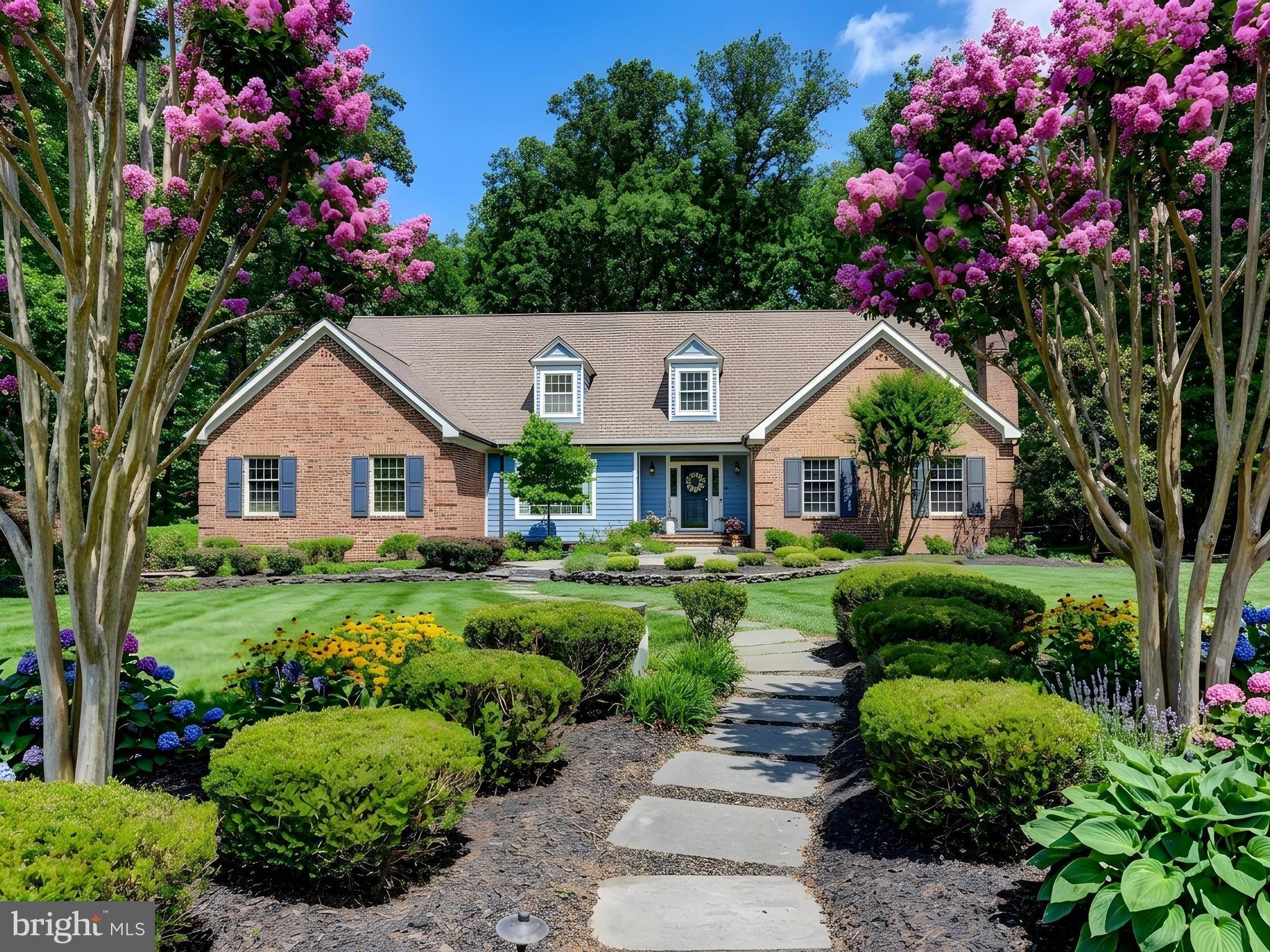 Springhill Farm Court is possibly the most coveted street along the always in demand Falls Road Corridor in Hunt Valley.  Convenient yet private.  Peaceful yet accessible.  46 Springhill Farm Court offers all of these features plus many more.  The rear yard connects directly to Oregon Ridge Park providing easy access to hundreds of miles of trails, not to mention privacy.  The first floor Primary suite adds another level of convenience and includes a gorgeous spa like bathroom that was completely renovated in 2025.  The kitchen was renovated in 2021 and features high end appliances, two islands and two sinks, for ease of living.  A recently renovated laundry room includes a perfect dog bath.  The sunroom is tucked away behind the kitchen and offers days long views of the rear yard and the park beyond.  On the second level of the home you will find four spacious bedrooms and two full bathrooms.  If you need more living space the basement is mostly finished and provides endless options and flexibility.  There is a three car garage with EV charger, epoxy floor, and additional storage.  Enjoy outdoor living space on the expansive deck and brand new patio in the rear.  This is a true 5 bedroom home with approximately 6800 square feet of living space on a cul-de-sac.  It is light and bright and has a great flow, and it is truly not to be missed.