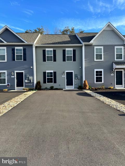 This stunning, brand new townhome features a luxurious 3 bedroom, 2 bath layout. The generous floor plan is designed with openness in mind, providing plenty of room for living and entertaining. Granite kitchen countertops not only add a touch of elegance to the space but are also renowned for their durability and resistance to heat, making them an ideal choice for those who love to cook. The modern lighting fixtures have been carefully selected to create a warm and welcoming ambiance, perfectly illuminating the kitchen's sleek design. The eat-in kitchen offers a comfortable and inviting space that merges functionality with casual dining. Just minutes away from, shopping, restaurants  and major highways such as I81 and Rt 340 making for an ideal commute. Be the first to reside in this new home!