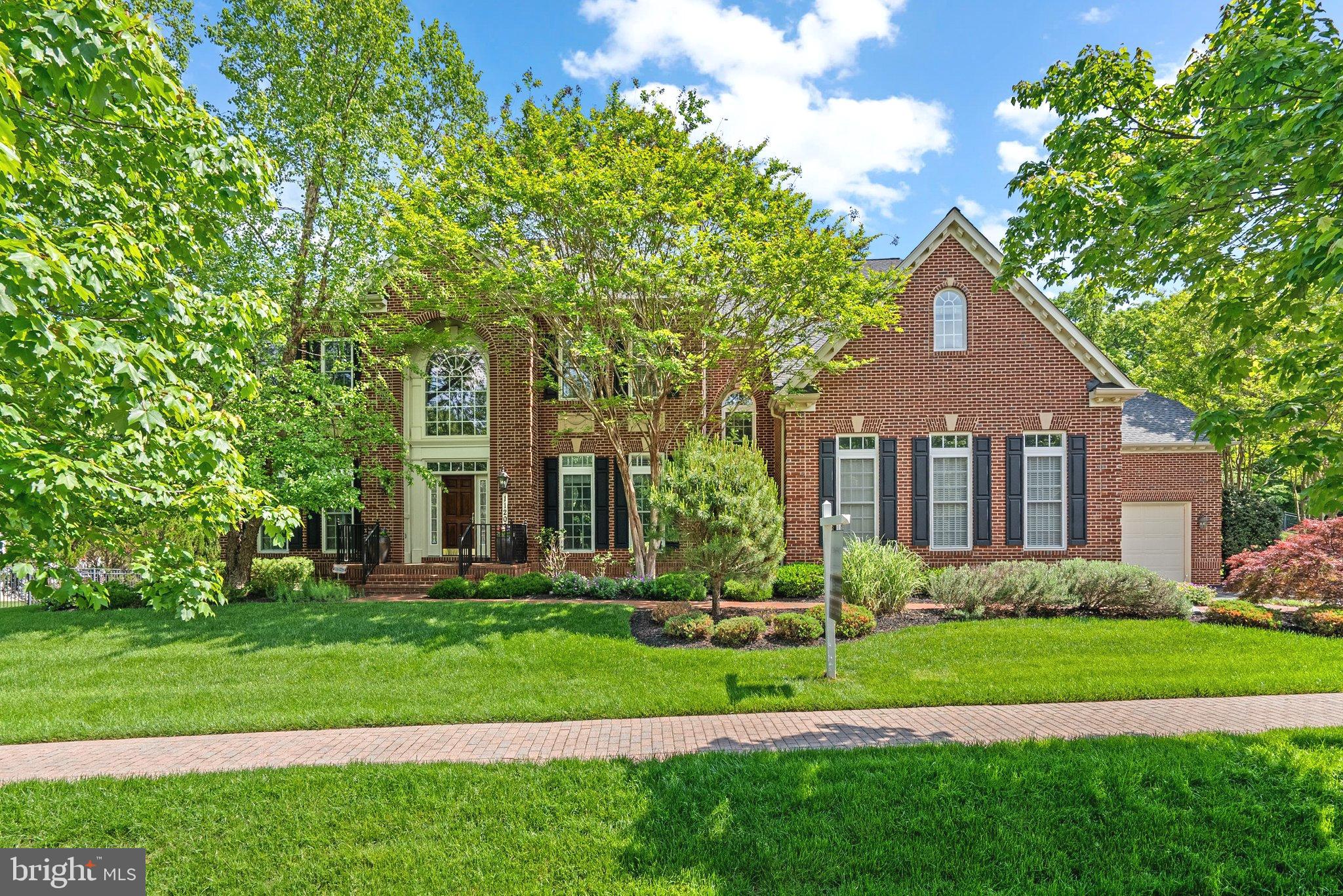 Welcome to a home that doesn’t just impress—it wows from the moment you walk in. Tucked into a coveted neighborhood on a  spectacular lot framed with mature trees and specimen plantings backing to a peaceful preserve and boasting the largest floor plan available, this property offers a rare mix of space, style, and substance. The dramatic double-height entry sets the stage, flanked by a sweeping dual staircase that makes a bold first impression. Rich hardwoods anchor the open-concept main level, where oversized windows and natural light steal the show.

The heart of the home is the chef’s kitchen—outfitted with Viking appliances, generous prep space, walk-in pantry, and a sunny breakfast room. It flows effortlessly into a warm, inviting family room centered around a fireplace. A second staircase tucked behind the kitchen adds a touch of function without sacrificing form. You’ll also find a banquet sized formal dining space with chandeliers, a stylish living room, a smartly designed mudroom, and a full-service laundry room, all thoughtfully laid out for daily ease.

Out back, the stone patio is your private outdoor retreat, complete with a built-in grill and fire pit—ideal for hosting under the stars or sipping coffee as you overlook the tree-lined yard.

Upstairs, unwind in a primary suite that feels more like a private retreat, featuring dual walk-in closets and a spa-inspired ensuite. Three additional bedrooms each offer their own full bath and walk-in closet—perfect for guests

The lower level delivers the ultimate entertainment zone: a custom bar, dedicated theater room, vast rec space, private guest suite, and dual walk-up exits to the backyard. Whether you're hosting a movie night or a holiday gathering, this level was built to impress.

Car lovers will appreciate the two separate two-car garages, offering storage and convenience galore. Major upgrades include a brand-new roof and water heater (2025), giving you peace of mind for years to come. Zoned to the highly sought-after Churchill School cluster, this home is a standout opportunity to live in a timeless, turnkey space that checks every box.
