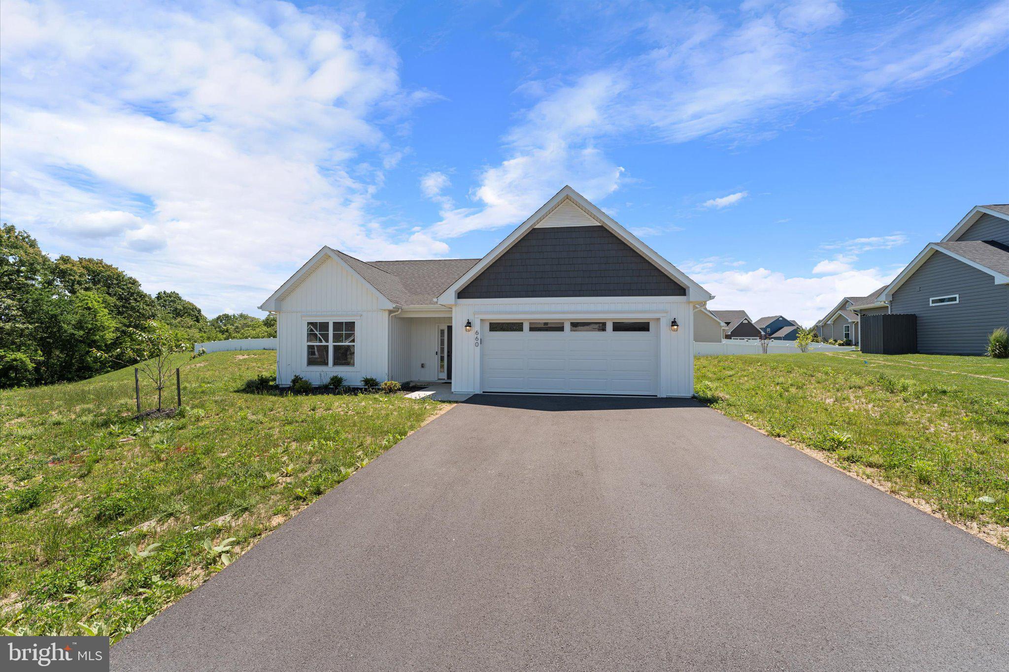 Welcome to 660 Barrel Race Road in the desirable Bridle Creek community of Martinsburg! This newly constructed ranch-style home offers the ease of one-level living with 3 bedrooms, 2 full baths, and a thoughtfully designed open layout.
Step inside to a welcoming foyer that opens into the spacious living and dining areas, perfect for everyday living and entertaining. The kitchen features a large center island with seating, upgraded countertops, pantry storage, and stainless steel appliances. The private primary suite includes a walk-in closet and an en-suite bath with a ceramic tile shower and glass door, while two generously sized secondary bedrooms share an additional full bath.
Enjoy outdoor living on the covered rear concrete porch, ideal for relaxing and taking in the surrounding scenery. Additional highlights include luxury vinyl plank flooring, recessed lighting, a dedicated laundry room, energy-efficient features, and a 2-car garage. Conveniently located near commuter routes, shopping, and dining, this move-in ready home combines modern comfort with peaceful surroundings.