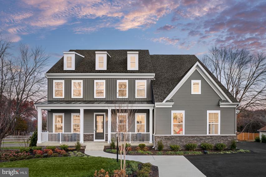 Final Available Home, See It Before It’s Gone! The stunning Taylor Model Home for sale at The Preserve at Long Branch. With convenient access to Dumfries Road, it's easy to explore all that Prince William County has to offer.

The main level of this feature-rich home offers everything you'd expect from modern design. It boasts a gourmet kitchen with a spacious sit-down island, a walk-in pantry, soaring 10-foot ceilings, and a convenient mudroom off the garage entry. Picture yourself preparing meals in the kitchen while loved ones gather in the open dining area, a perfect space for hosting and entertaining. A private guest suite is thoughtfully located at the rear of the home, while a secluded study near the front provides an ideal setup for working from home.

The upper level boasts a spacious primary suite, complete with a cozy sitting area, two expansive walk-in closets, and a spa-inspired bathroom designed for ultimate relaxation. This level also includes a convenient full-size laundry room and three additional bedrooms, each featuring its own walk-in closet for ample storage. But that's not all—this amazing home also includes an additional loft-level with a rooftop terrace, a full bath, and a home office.

The finished lower level offers a versatile space designed to meet all your needs. It includes a spacious recreation room, a dedicated media room, and a flexible den that can be transformed into a game room, home office, gym, playroom, or even a guest suite—the possibilities are endless. With its thoughtful design and abundant space, The Taylor offers room for everyone to live, relax, and thrive. 

Schedule Your Private Tour Today!