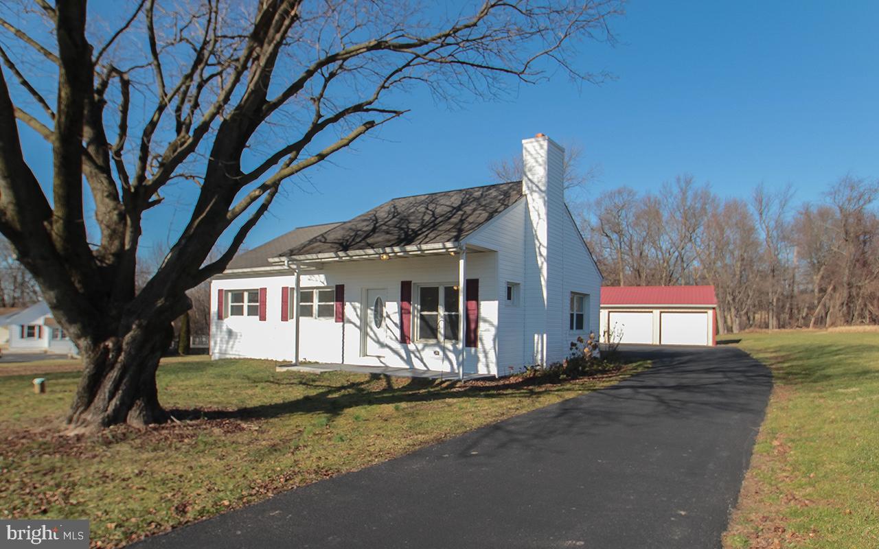 Completely Renovated in Beautiful White Hall, this 3 bedroom home is turn key ready! The updated kitchen features all new Stainless Steal appliances with Gas Range, and separate eating area.  The wide open living area with wood burning fireplace also has new flooring and fresh paint.  The main level full bath has New Toilet, New Vanity, New lighting, ceramic  tile flooring, and a linen closet with attic access.  Each bedroom is flooded with natural light, showing off their new floors and fresh paint as well!   The large lower level is ready for your design!  New Sump Pump 2023, freshly dry locked walls, New Pressure Tank 2023, New Furnace 2020, New Digital Thermostat Jan 2024! New Hot Water Tank 2020, New doors and updated stairwell entry 2023!  The Exterior of this home also boasts upgrades of all New Siding 2023, New Basement Windows 2023,  New Chimney Cap scheduled for this month, New Exterior Doors and Trim 2023, new poured concrete Patio 2023, Driveway freshly Seal Coated in 2023!! Central AC! In addition to the home, there is a garden shed, and large detached multi car garage/workshop, with full electric and garage door openers!  Plenty of space to work on projects, store equipment and get creative.  This lot stretches a full 1.13 acres going back into the woods- leaving plenty of space to fence in for a dog, set up corn hole, volley ball, or even your own garden.  This home is ready for you to move in!