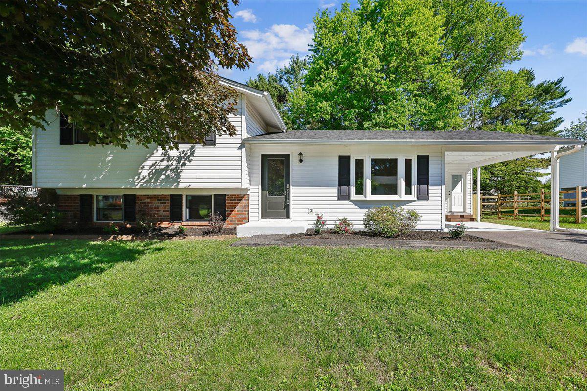 Price adjustment. Welcome to this beautifully renovated single-family split-level house at 24321 Log House Rd, Gaithersburg, MD, 20882. From the moment you drive by, you will notice the fresh curb appeal, with brand-new siding throughout the house, a newly replaced roof, and windows. 
Step inside through the main entrance, and you’ll be greeted by an open-concept floor plan filled with abundant natural light. A stunning new engineered-wood floor flows throughout the main and upper levels, creating warmth and elegance. 
The brand-new kitchen features sleek stainless-steel appliances and an access door to the carport, making it easy to unload your groceries. Just off the kitchen area, new sliding doors open to the large backyard and spacious deck, for outdoor living and entertaining.
The newly updated hallway bathroom boasts a double-sink vanity and a striking, large leaded-glass mirror.
The expansive master bedroom features a private full bathroom with an additional double-sink vanity and a large walk-in closet.
The bright and cozy family room is highlighted by a wood-burning fireplace, perfect for relaxing. This third-level floor features an additional brand-new full bathroom, making the home ideal for families or guests.
The fully finished basement provides versatile space for an exercise room, home theater, or extra entertainment area. This meticulously updated home is move-in ready. Come see it for yourself—seeing is believing!