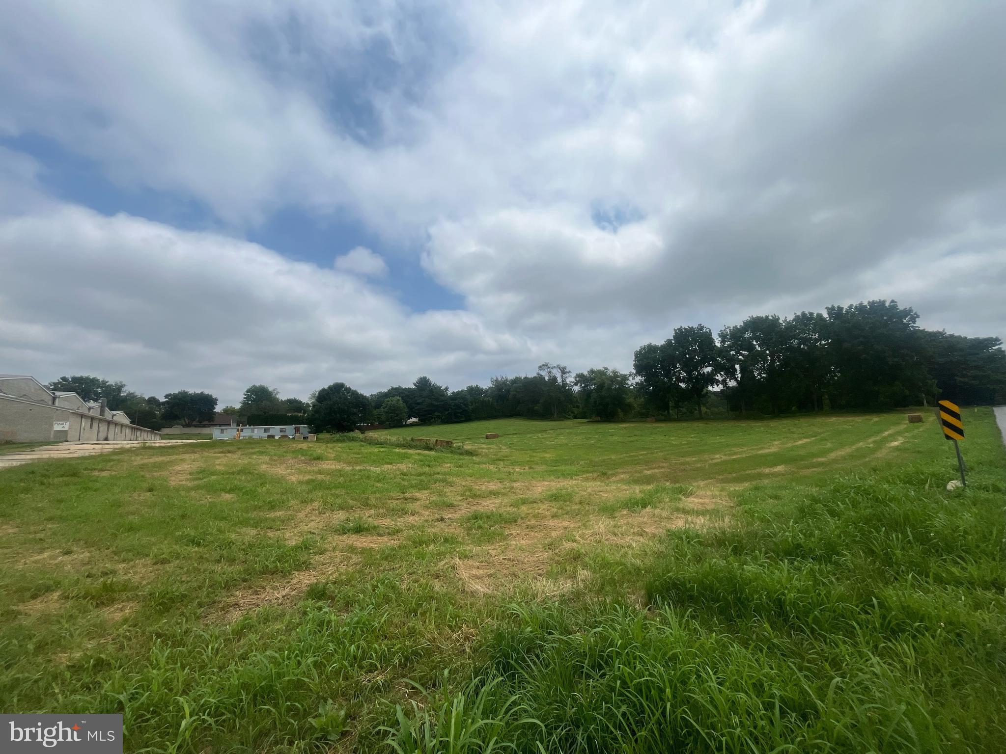 Excellent opportunity for investors or agricultural users - this 6.6-acre property in Kennett Township is located directly adjacent to Kennett Square Borough and features a versatile mix of existing improvements and long-term potential. The parcel includes four 68-foot double mushroom houses, a storage shed, and a 2-bedroom ranch-style home, offering immediate utility for farming or agricultural-related operations.

Zoned Specialized Agriculture (SA), zoning permits agriculture-related warehousing, indoor storage, or distribution facilities by right, and boarding kennels by special exception. The property is enrolled in Act 319, which may provide tax benefits.

With a neighboring parcel zoned Residential Medium to High Density (RMHD), rezoning may be possible, potentially allowing for single-family homes, twins, or retirement communities by right, and townhouses (up to 6 units/acre) or multifamily dwellings (up to 12 units/acre) by conditional use.

Additional adjacent acreage is available - see listings for 114, 115, and 117 Chandler Mill Road. Located in the award-winning Kennett Consolidated School District, just minutes from downtown Kennett Square, Longwood Gardens, and major routes.

Buyer to verify all zoning, subdivision, and rezoning requirements with Kennett Township.