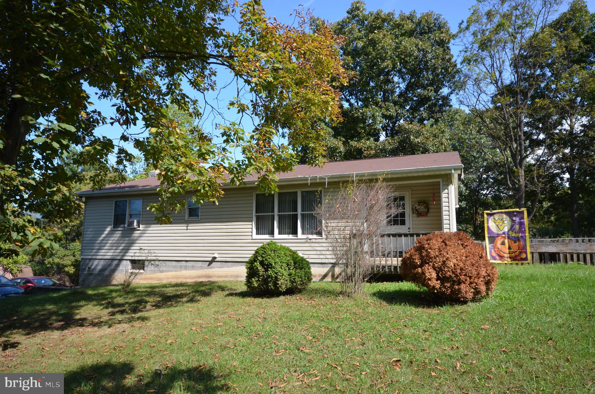 Stick built ranch home with 6" exterior framing and finished basement.  Enjoy the outdoors on this 2.4 acre property, or at the deeded access to the south branch of the Potomac River.  The main level has three spacious bedrooms and two full baths.  There is a third full bath in the finished lower level.  The lower level also has a spacious rec-room, wood stove and bar.    The heat pump was just replaced in 2024.  The roof was replaced in 2017 and the back porch was built in 2020.   Easy commuting distance to Cumberland, Romney or Winchester.  Hot tub included in sale.