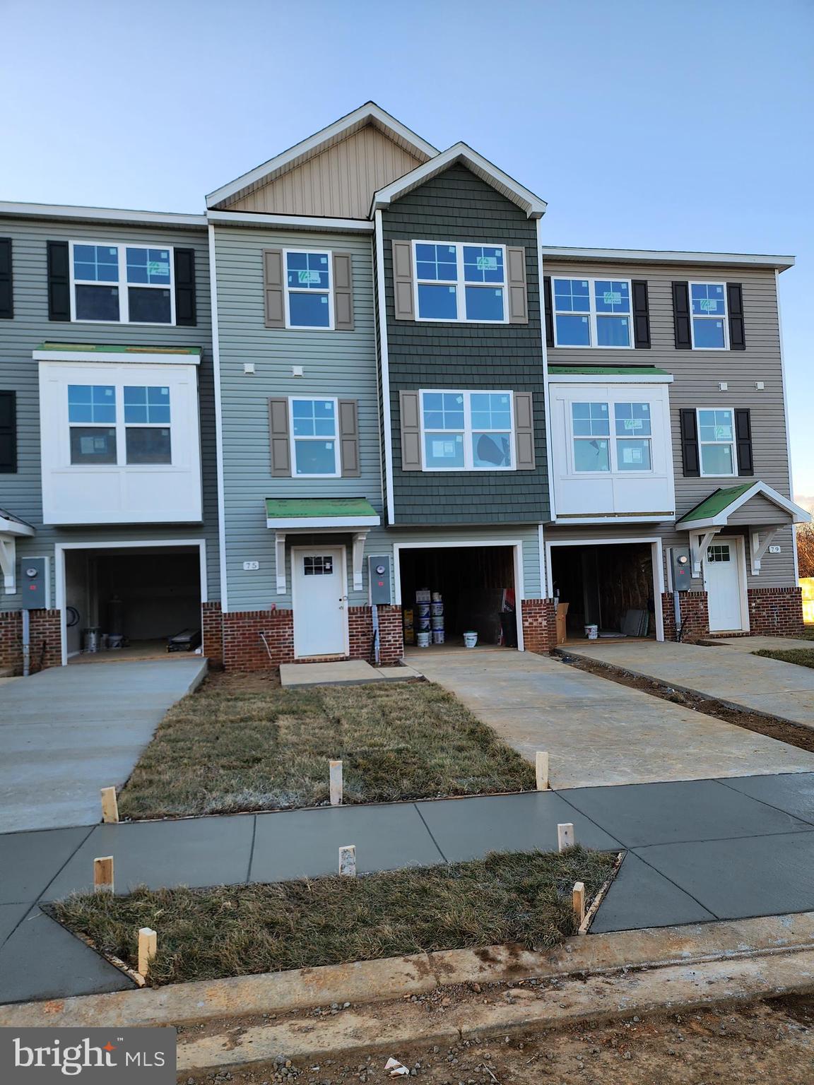 Under Construction with 60-75 Day Delivery!
YOUR FIRST YEARS POWER BILL IS ON US!!!! Up to 3% closing cost assistance!!!
The Berkeley II Garage townhome is a 4 bedroom, 3.5 bath garage townhome has an open concept design on the main floor w/ a kitchen island with granite top, 42" cabinets colored in Sage, a high low peninsula with granite top for entertaining, stainless-steel appliances, a large living room w/ a bump out and a half bath. The upper level features a large primary bedroom w/ cathedral ceiling, walk-in closet, double vanity and a walk-in tile shower; two guest bedrooms, one of which has a 2-story bump out, full guest bathroom, linen closet and laundry. The lower levels feature a coat closet, foyer, single car garage w/ automatic garage door opener (app enabled also) and fourth bedroom with a full bath w/ door to access to your backyard, this room makes a great recreation room as well. There will be NO homes built behind you here!!! Throughout the home you will find recessed LED's, ceiling fans in the Primary bedroom & living room w/ each additional bedroom pre-wired for ceiling fans. High/Low outlets w/ pass through plates w/ CAT5/COAX/HDMI in Owner's bedroom & living room to make mounting your TV a breeze. You get more for your money with Four Points Construction. We are a featured loaded builder.  Winner of WV Best in Class for Energy Efficiency - The Communities of Burwell has done it again! Pictures are of similar construction townhome.

We do not have a townhome model home.