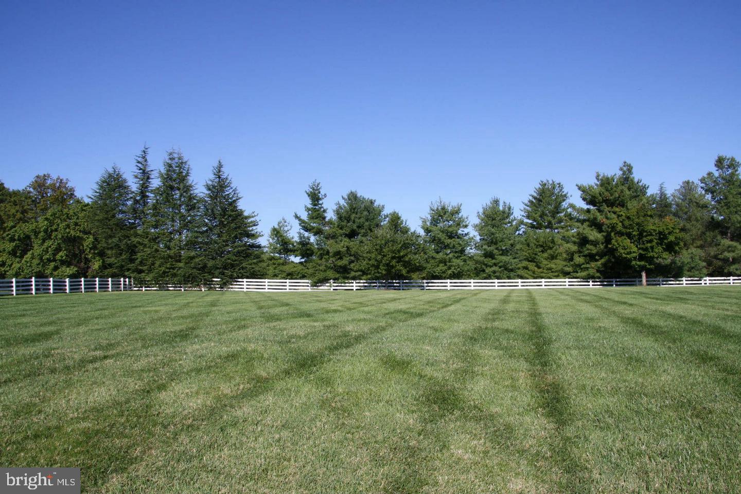 Rare 4.29-acre estate homesite in prestigious Potomac. Ready to build and complete with existing tennis courts, this exceptional property offers the perfect setting for a world-class custom residence. Enjoy privacy, mature surroundings, and endless possibilities for resort-style living with room for a pool, guest house, gardens, and expansive outdoor entertaining spaces. Ideally located near Potomac Village, renowned schools, country clubs, and convenient access to Bethesda and Washington, DC.