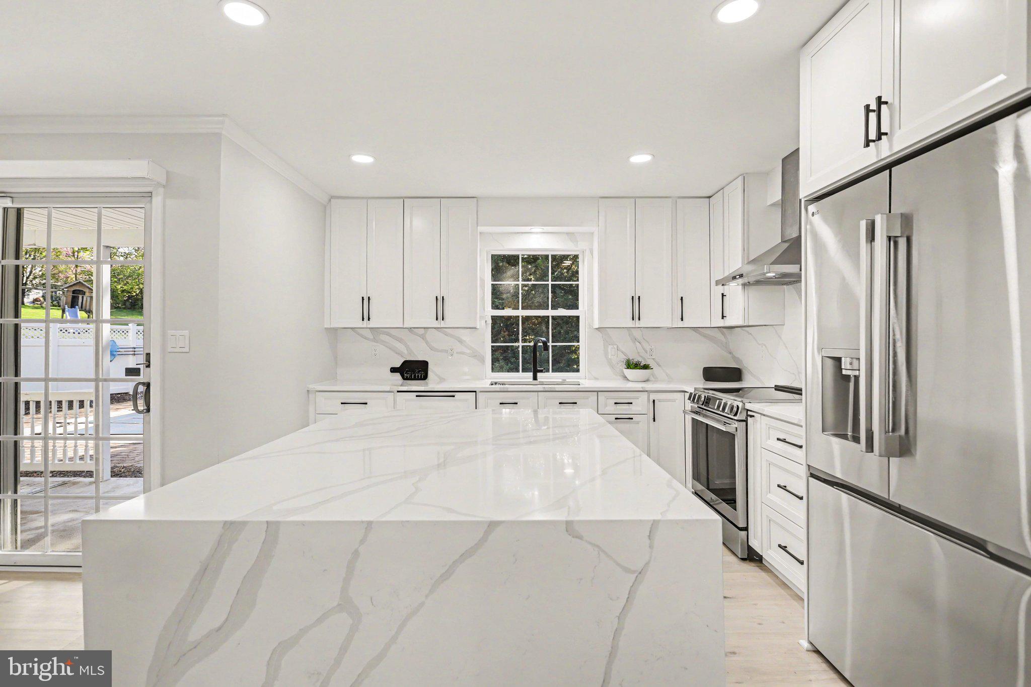 Welcome to your dream home featuring a stunning modern kitchen, spa-like primary en suite bathroom, fully finished basement with an impressive built-in bar, and a sparkling in-ground pool and spa ready for summer enjoyment.
Completely transformed with over $140,000 in renovations, this stunning Autumn Ridge home delivers the perfect combination of modern design, luxury finishes, and summer-ready outdoor living. All of this ready for you to move in and enjoy right away.
At the heart of the home is a show-stopping kitchen that was rebuilt from the studs and designed for both everyday living and entertaining. Featuring quartz countertops, a dramatic waterfall island, stainless steel appliances, a functional drop zone, and a unique pass-through serving window to the patio, this space is as beautiful as it is practical.
Throughout the home, you'll find luxury vinyl plank flooring, fresh paint, updated lighting, custom trim details, recessed lighting, and thoughtfully selected finishes that create a cohesive, high-end feel. The main living area is anchored by a striking gas fireplace with a porcelain surround, creating a warm and inviting gathering space.
Upstairs, the fully renovated primary suite feels like a private retreat, complete with a freestanding soaking tub and spa-inspired wet room style shower with custom tile work. Both full bathrooms have been extensively updated with modern fixtures, vanities, and finishes.
The finished lower level adds incredible flexibility, offering a wet bar with refrigerator, dishwasher, and sink, theater-style seating, and a spacious recreation area. Need additional bedroom space? The current billiards room could easily serve as a fifth bedroom.
Step outside and enjoy your own private backyard oasis. The in-ground pool and spa have been refreshed with a new liner and heater, creating the ultimate setting for relaxing, entertaining, and making the most of the summer season. Updated landscaping further enhances the outdoor experience.
Beyond the backyard, you'll enjoy direct access to approximately one acre of community green space located just behind the property, providing room to spread out, play, and enjoy the outdoors.
The major updates have already been completed. Simply move in and start enjoying everything this exceptional home has to offer.