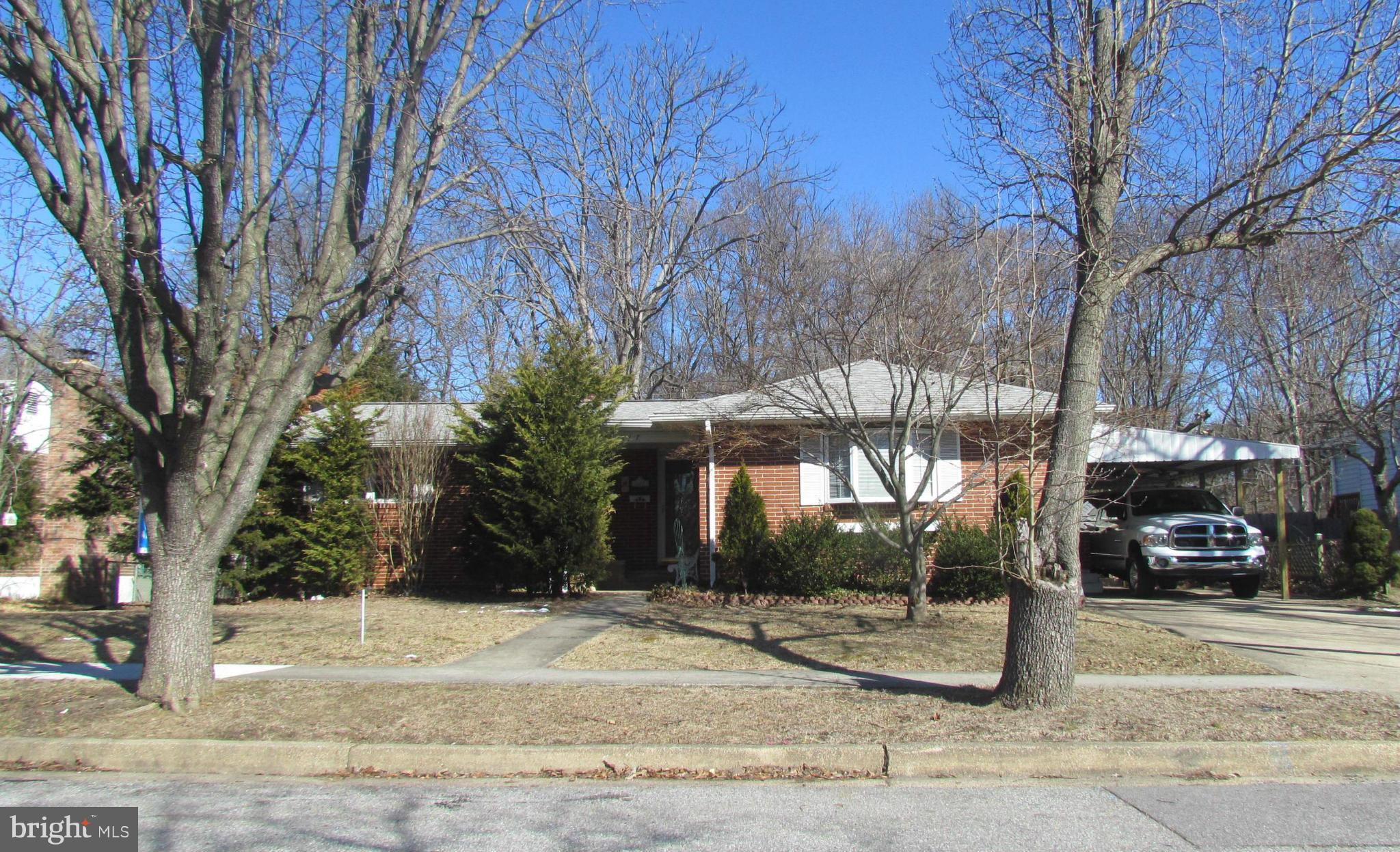 Larger than it appears and with kitchen upgrades. Possible 4th bedroom in basement. Don't need another bedroom, then use room as a play room, den or office. Hardwood floors under wall to wall carpet. Large family room addition on main level of house and another large family room in basement with a fireplace. New carpet in dining room. Off street parking sufficient for multiple cars or an RV.