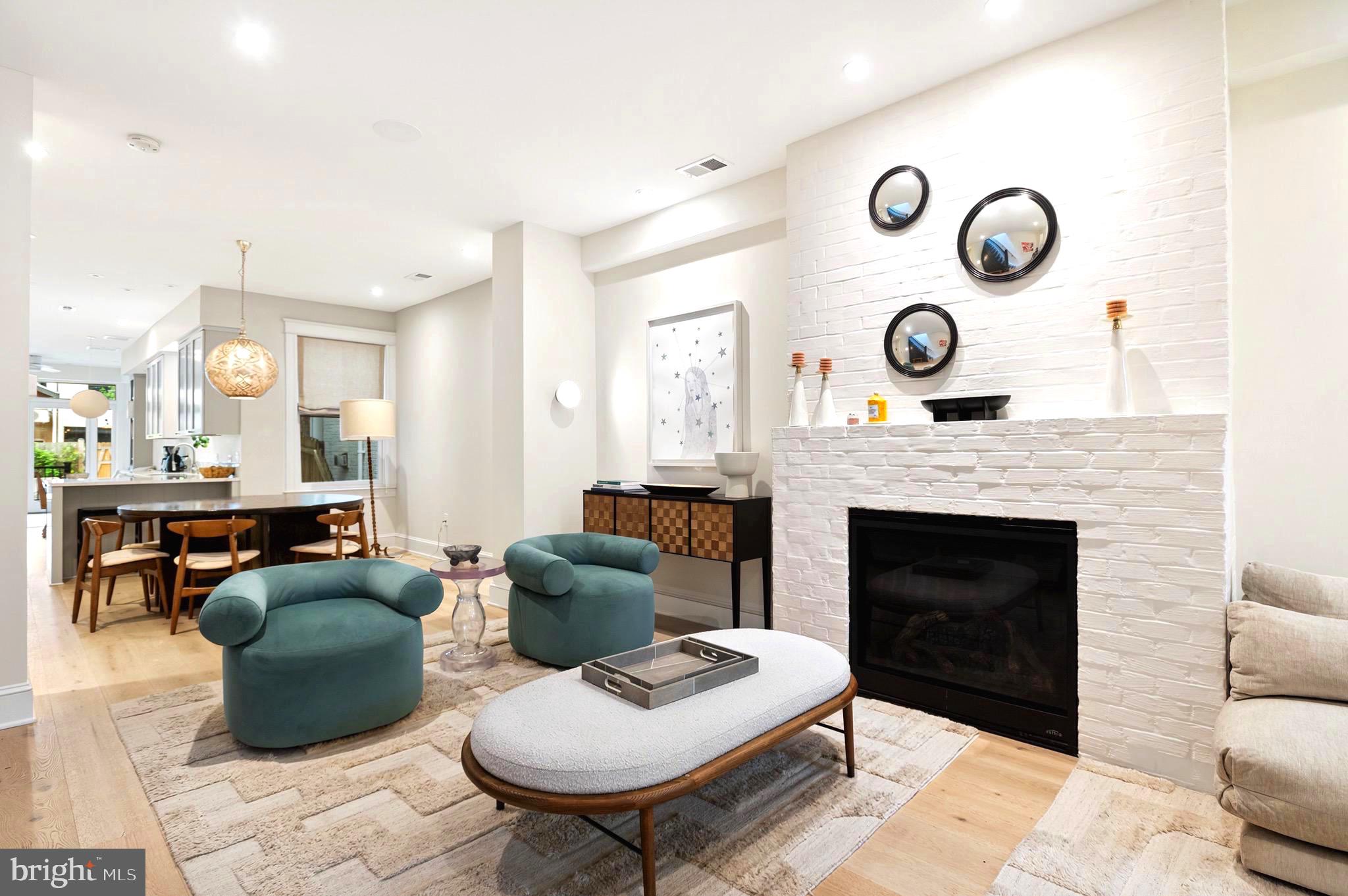 2325 20th St NW is a truly special property showcasing a thoughtful renovation by the boutique design firm Peltrie Place, and features a deep lot offering a large patio and rear yard as well as two car parking. This home has been featured in Architectural Digest highlighting its transformation - every detail has a purpose and creates a sophisticated, luxurious retreat with intentional living spaces. The main level has a spacious living room with fireplace, dining room, a chef's kitchen that opens to a breakfast nook and family room before leading to the back deck, patio and yard. The upper level has a generous primary suite with a large walk-in closet and spa-like primary bath. There are two additional bedrooms and full bathroom as well as laundry and a large custom-built office space. The lower level has a fabulous custom bar below the stairs and a great family room with custom built-ins. There is an additional bedroom, full bath, gym or storage room and large laundry room with additional storage. The outdoor space completes this incredible offering with a rear deck, expansive patio for entertaining and additional rear yard. There is also a roofdeck off the primary suite providing incredible views of the city. Two car parking included.