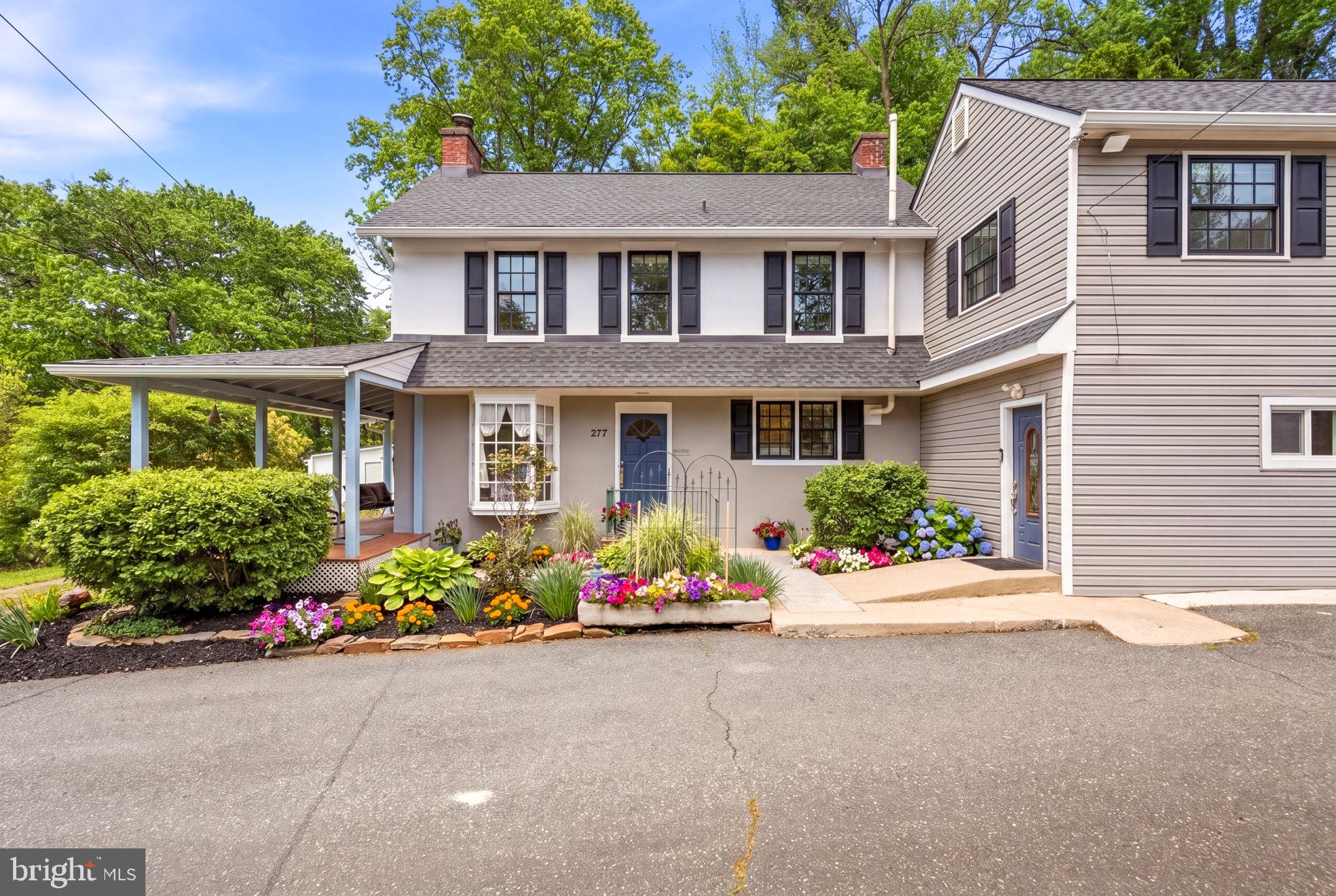 Residentially Zoned with Approved Business Variance – A Rare Live/Work Opportunity. Prominently positioned along Baltimore Pike, this exceptional estate offers the unique advantage of an approved business variance with exterior signage permitted, providing outstanding visibility and exposure. The thoughtfully designed layout features a  SEPARATE PRIVATE WING ideal for a law office, title company, CPA firm, consulting practice, art studio, wellness business, or other professional use, while maintaining COMPLETE PRIVACY AND SEPARATION from the main residence. Alternatively, the space may be converted into a  TWO CAR GARAGE, offering flexibility to suit a variety of lifestyle or business needs.
Set on 2.83 acres of picturesque Pennsylvania countryside, this gracious, light-filled 5-bedroom, 2 full and 2 half-bath STUCCO-OVER STONE ESTATE seamlessly blends timeless 17th-century character with modern functionality. The home offers exceptional curb appeal, defined by its classic stone architecture, preserved period details, and commanding presence. A beautifully private rear patio extends the living experience outdoors, creating a serene setting for relaxation or elegant entertaining.
Inside, beautifully maintained hardwood floors, vaulted ceilings, custom built-ins, refined millwork, and abundant natural light showcase the home's craftsmanship and character. The renovated chef’s kitchen features a gas stove, expansive center island, spacious pantry, fireplace, and striking original fieldstone accent wall, with direct access to the rear patio for seamless indoor-outdoor living.
The second level includes a SPACIOUS PRIMARY SUITE with an updated spa-inspired bath featuring a soaking tub and walk-in shower, along with additional bedrooms and updated baths. A large flexible bonus area offers possibilities as an in-law suite, playroom, office, or lounge space.
Recent improvements include a new roof (2020), updated windows and skylights, electrical upgrades, basement waterproofing (2023), and a new zoned hydronic heating system. Located in the highly regarded Rose Tree Media School District and conveniently close to major routes, shopping, dining, and regional amenities, this distinctive property presents a rare opportunity to enjoy luxury residential living while operating a business from home with unmatched visibility and flexibility.