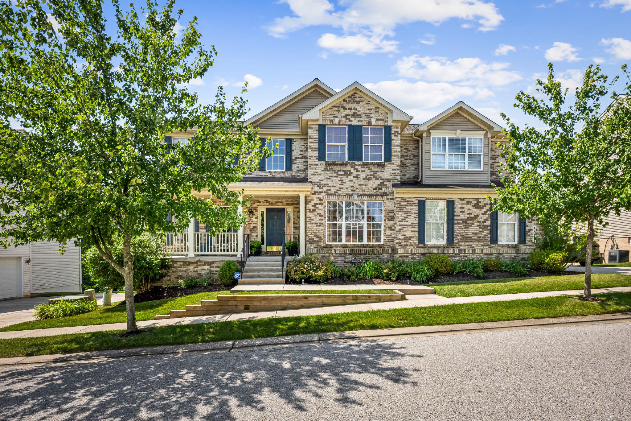 Welcome to 5017 Autumn Glow Way, a beautifully maintained 5-bedroom, 3.5-bathroom home in the highly sought-after Forge Landing community of Perry Hall. Offering nearly 4,000 finished square feet of living space, this spacious home combines thoughtful updates, generous living areas, and a private setting backing to a wooded area.

The heart of the home is the updated kitchen, which underwent a partial renovation in 2024 featuring a new center island, custom drink station with wine fridge, updated lighting, and a stylish backsplash. The kitchen opens to comfortable living and dining spaces and provides direct access to the large deck overlooking the backyard and tranquil wooded setting. Below, a paver patio creates the perfect space for outdoor entertaining, relaxing, or enjoying meals with family and friends.

The expansive finished basement offers exceptional flexibility for a recreation room, home theater, fitness area, home office, and/or guest bedroom. Fresh paint in the basement, foyer, and upstairs hallway enhances the home's bright and welcoming feel.

Upstairs, you'll find four generously sized bedrooms, including a spacious primary suite. The primary bathroom was tastefully remodeled in 2026 with a new vanity, counter-top, and beautifully updated shower, creating a private retreat to start and end your day.

This home has been meticulously maintained with numerous updates, including a roof replacement in 2018, a new furnace in 2019 with the combustion chamber replaced in 2021, air conditioning replaced in 2015, a new basement sliding glass door installed in 2021, and hardwood floors refinished in 2022.

Additional highlights include a 2-car side-load garage, mature landscaping, and a premium lot that backs to trees for added privacy. Conveniently located near shopping, dining, parks, schools, and major commuter routes, this move-in-ready home offers the perfect combination of space, updates, and location in one of Perry Hall's most desirable communities.

Don't miss this opportunity to make 5017 Autumn Glow Way your next home.