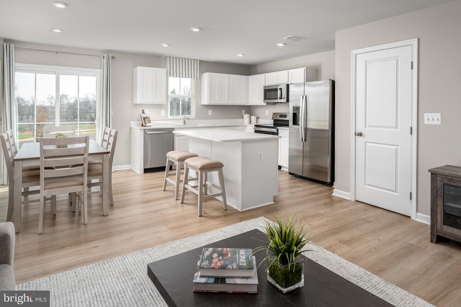 This is the QUICK MOVE IN Poplar floorplan at the Cardinal Pointe Community!  This stunning, brand new 3-bedroom 2.5 bath townhome boasts an open floorplan, a spacious kitchen island, LVP flooring, stainless steel appliances, white cabinetry, a beautiful backyard, and is an END UNIT! The wide-open great room flows seamlessly into the gourmet kitchen and light-filled dining area, where the kitchen island provides extra storage and counter space. Upstairs, find two generous secondary bedrooms and a full bath. The conveniently placed laundry room is on the same level as the bedrooms and includes your washer/dryer. The owner's suite includes a dual vanity bath and enormous walk-in closet. Don't let this Poplar pass you by! The community is only a mile from the Spring Mills shopping center for all of your daily conveniences. 15 minutes to Hagerstown, 30 minutes to both Frederick, MD and Winchester, VA and easy access to major highways and public transportation.  The newest county school campus is just a mile away!  Don't miss your chance to own a piece of this beautiful community.  Contact us today for a private tour.  Photos are representative.